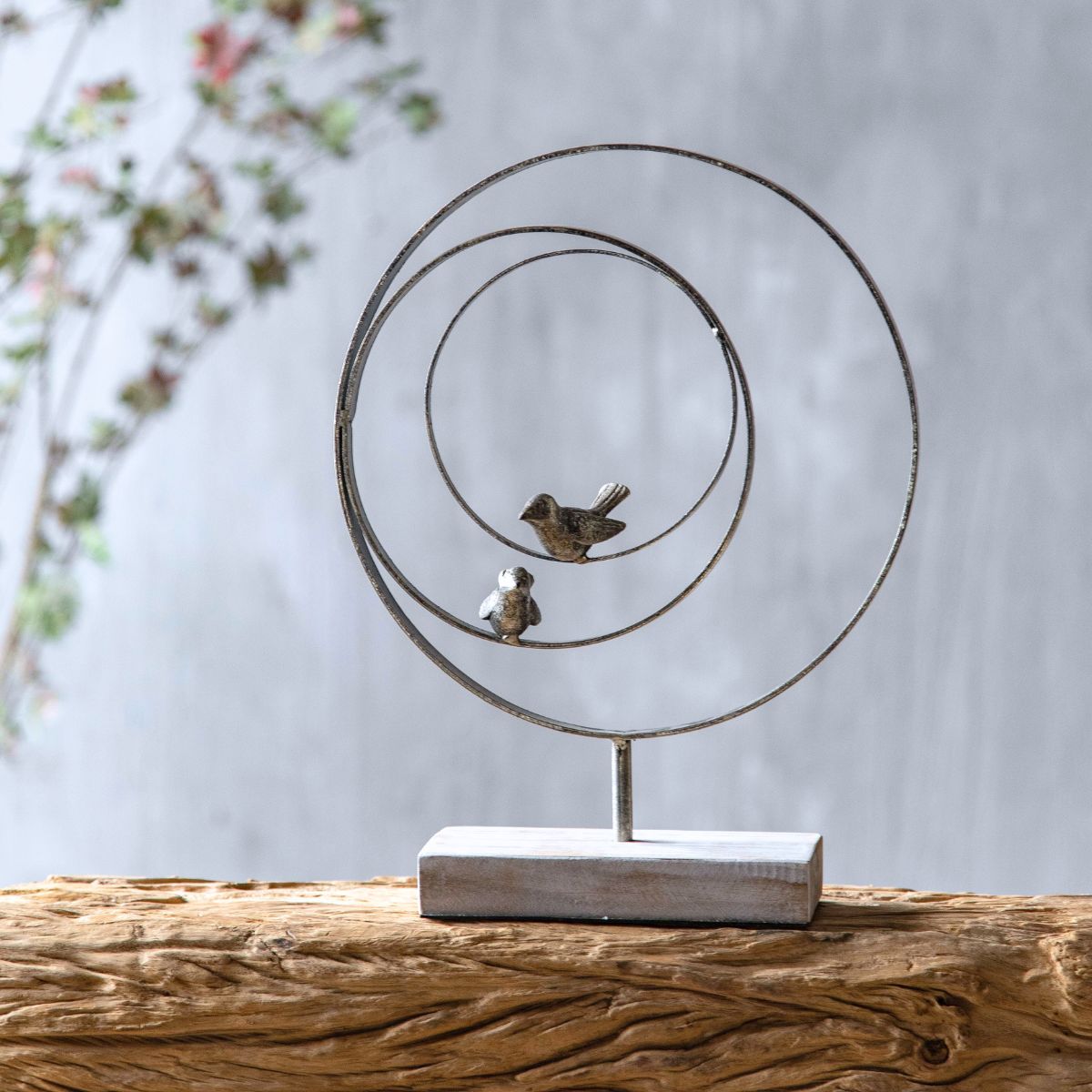 Tristan bird sculpture styled on a French Provincial sideboard with linen and greenery