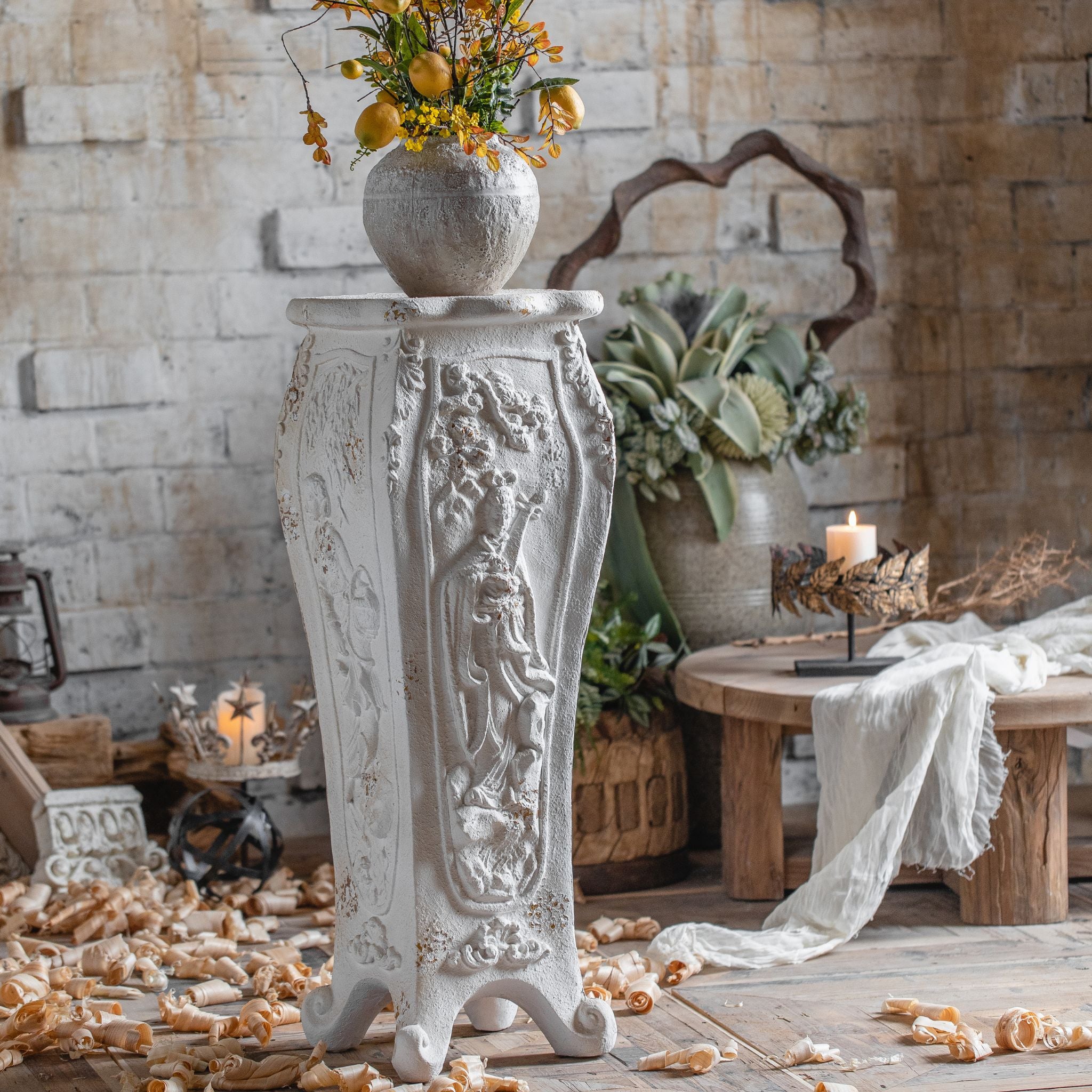 Cadiz pedestal plant stand in aged white with maiden relief panels and scroll feet