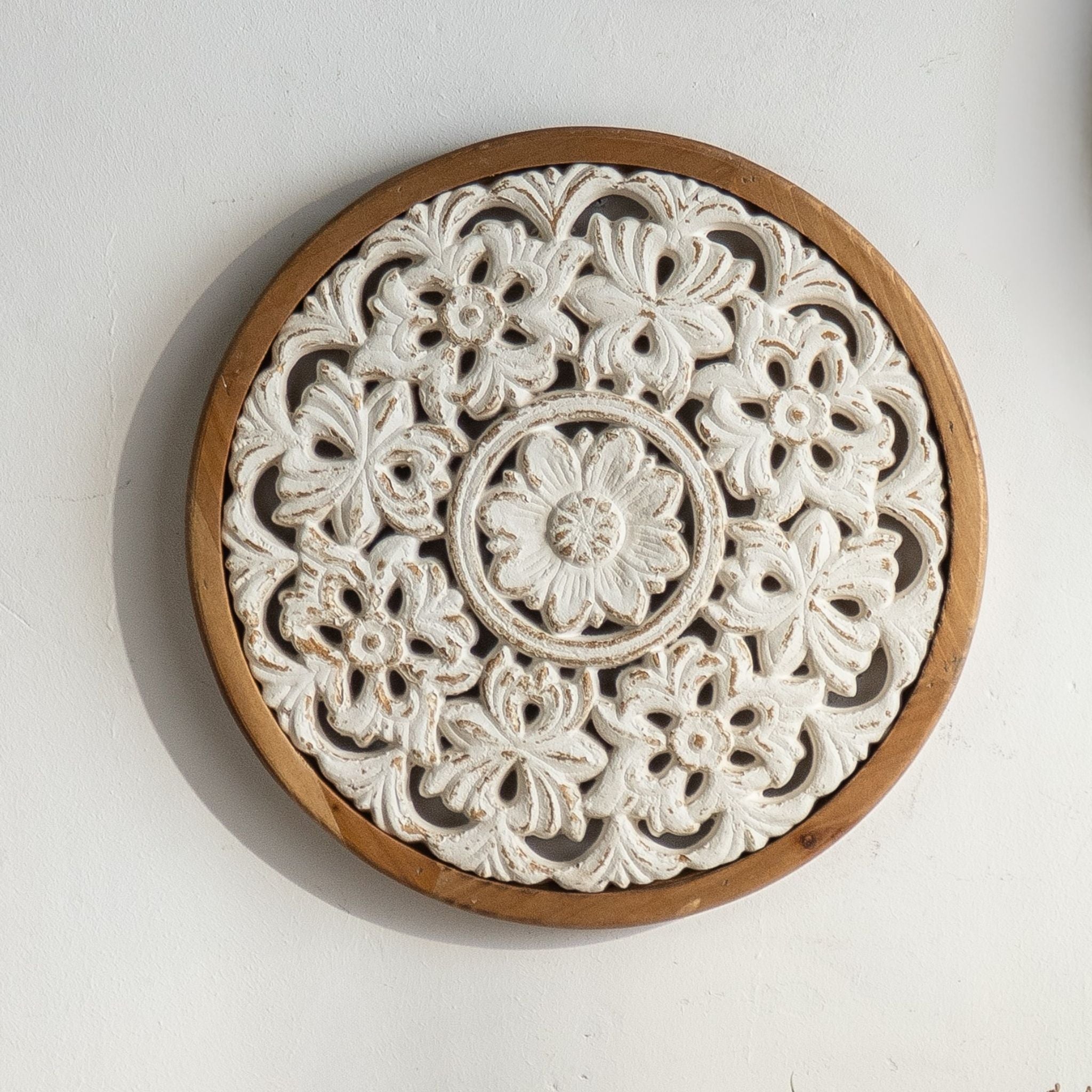 Vito round carved wall art with flower cluster carving in whitewashed timber and natural hoop frame