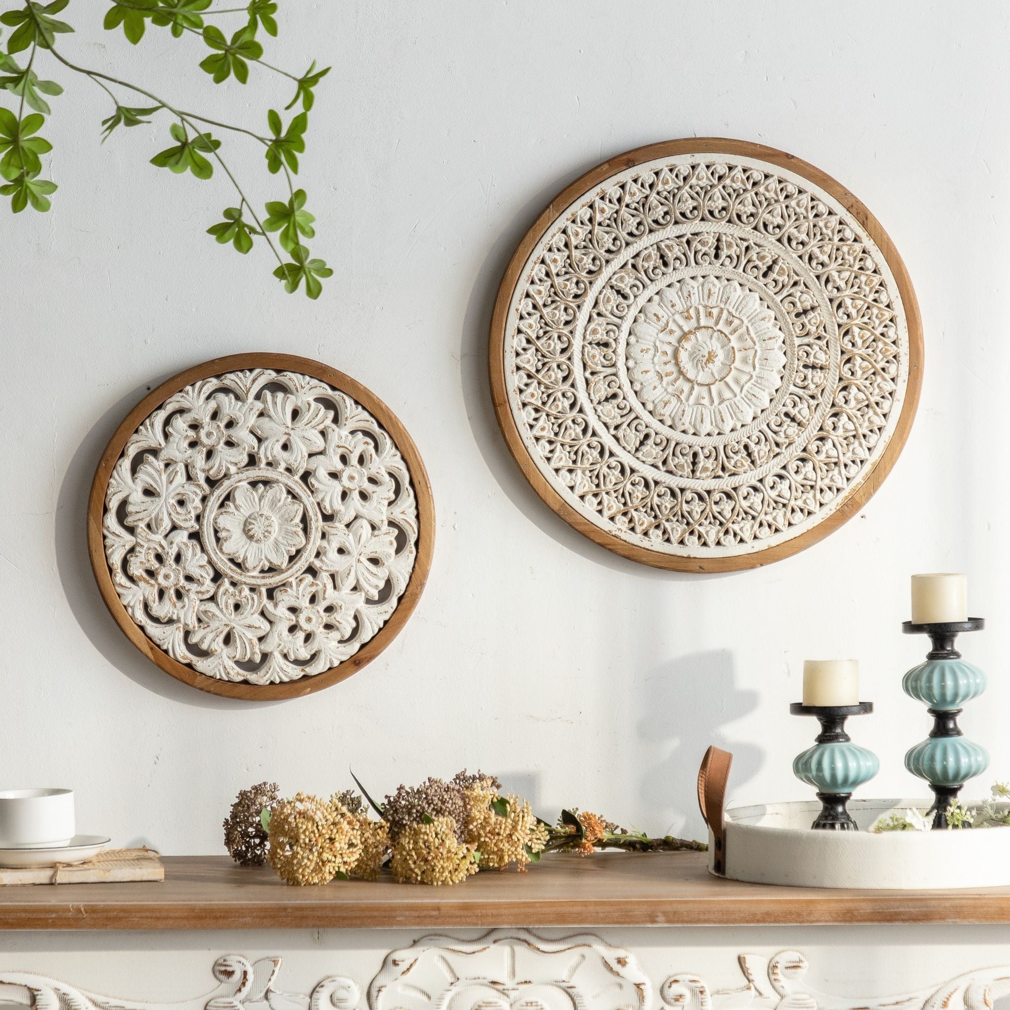 Vito round carved panel styled on a wall with his larger companion