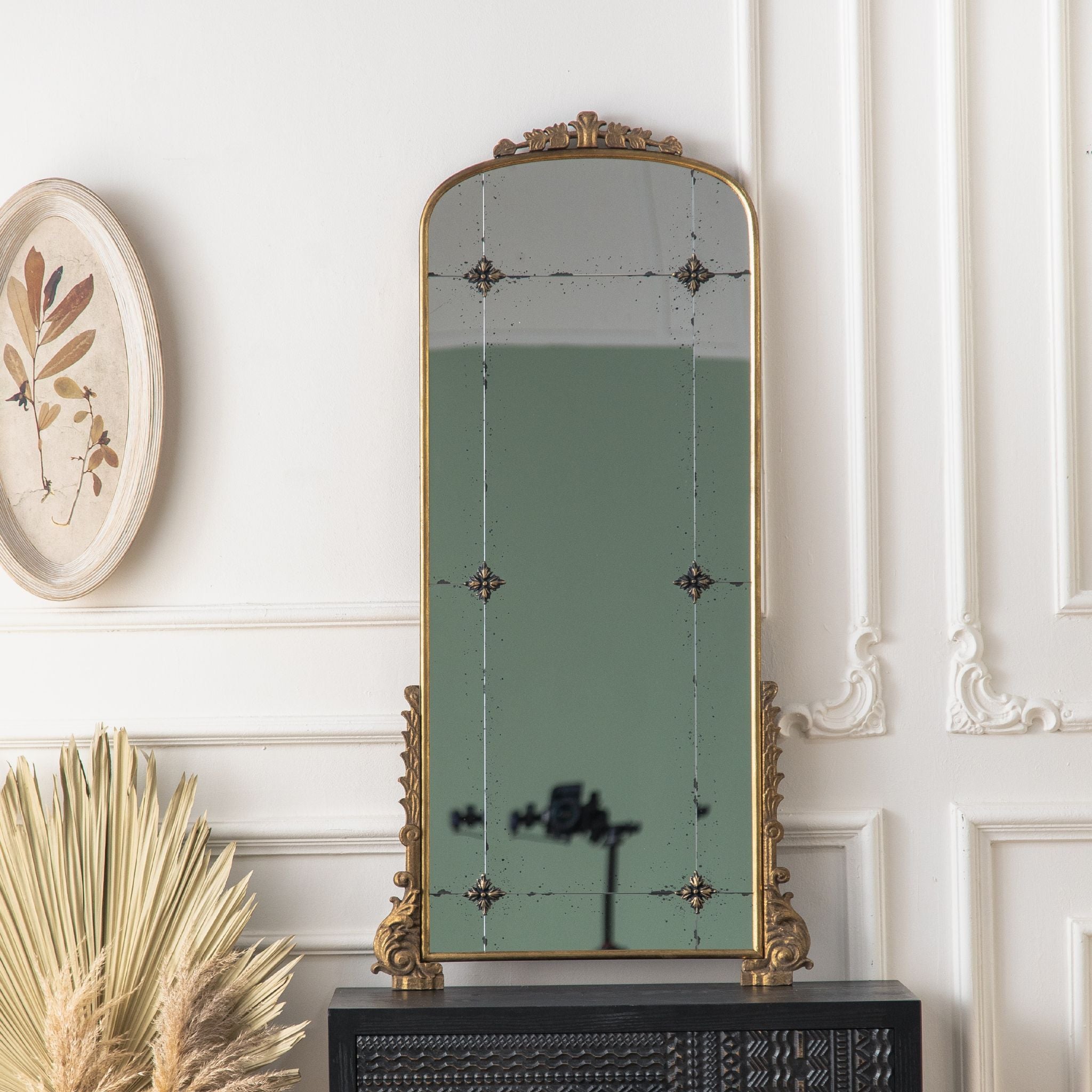 Thea arched mirror full scene in a panelled room