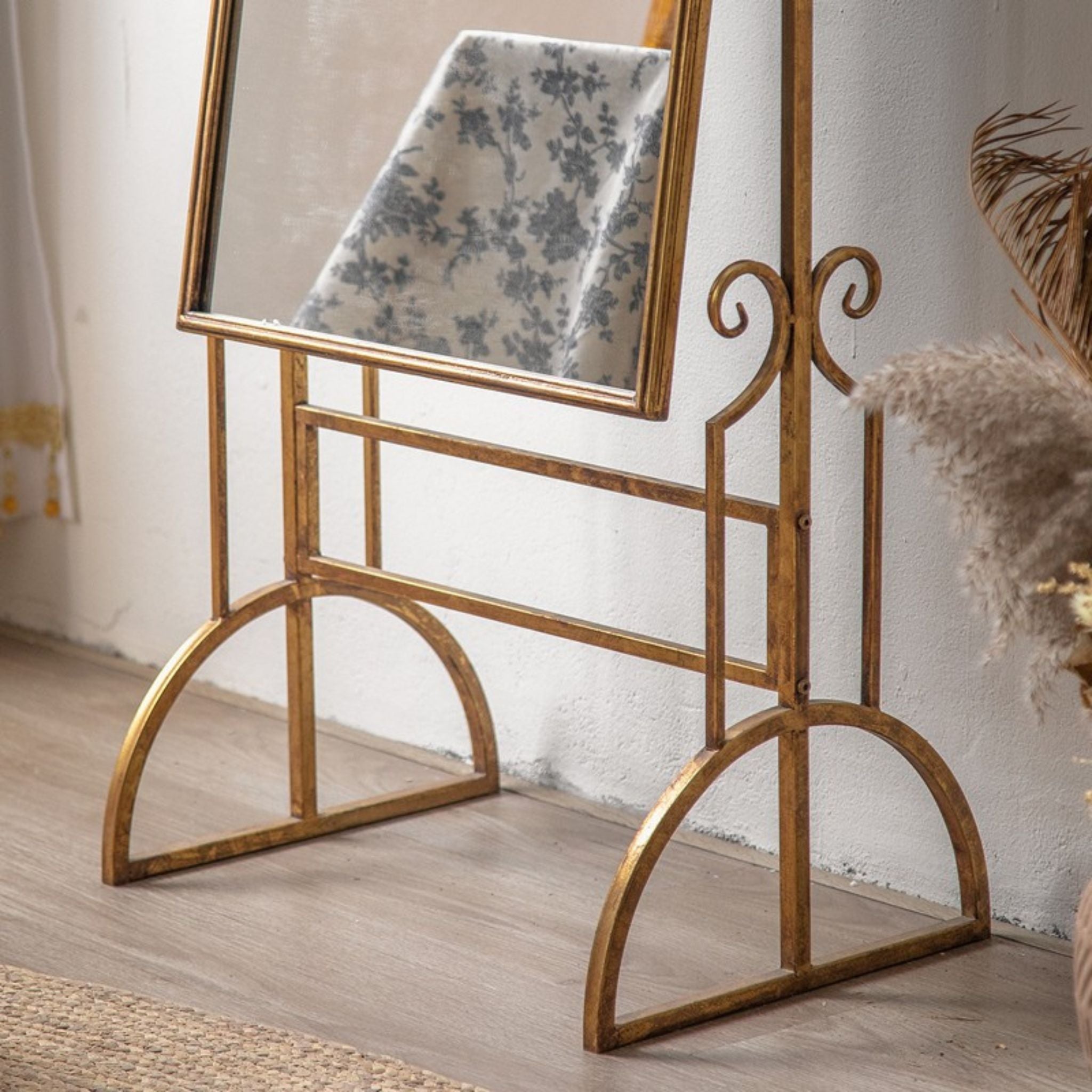 Sorrento antique gold cheval mirror styled beside a table with peonies