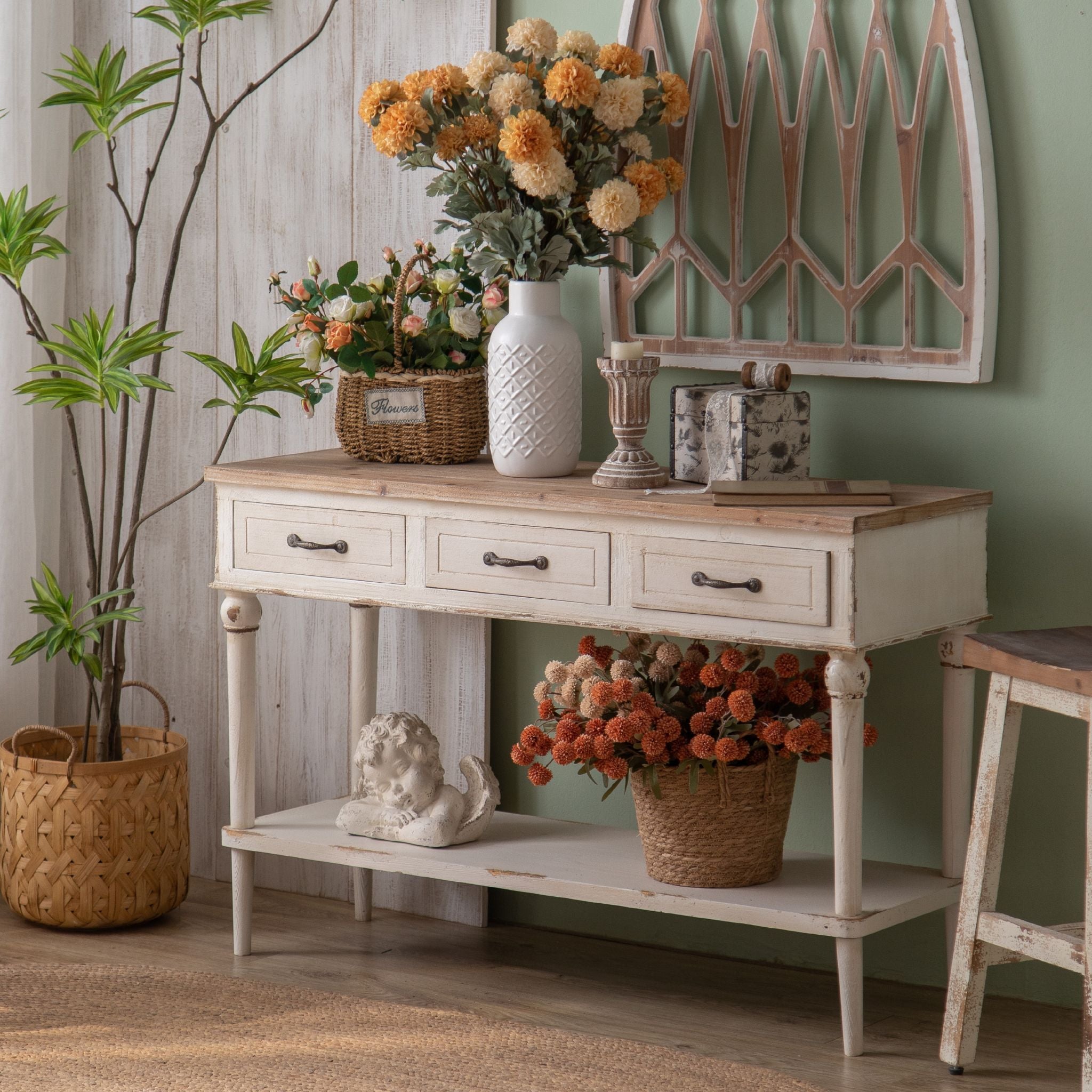 Seville three drawer console with lower shelf styled in an entry with arch wall panel