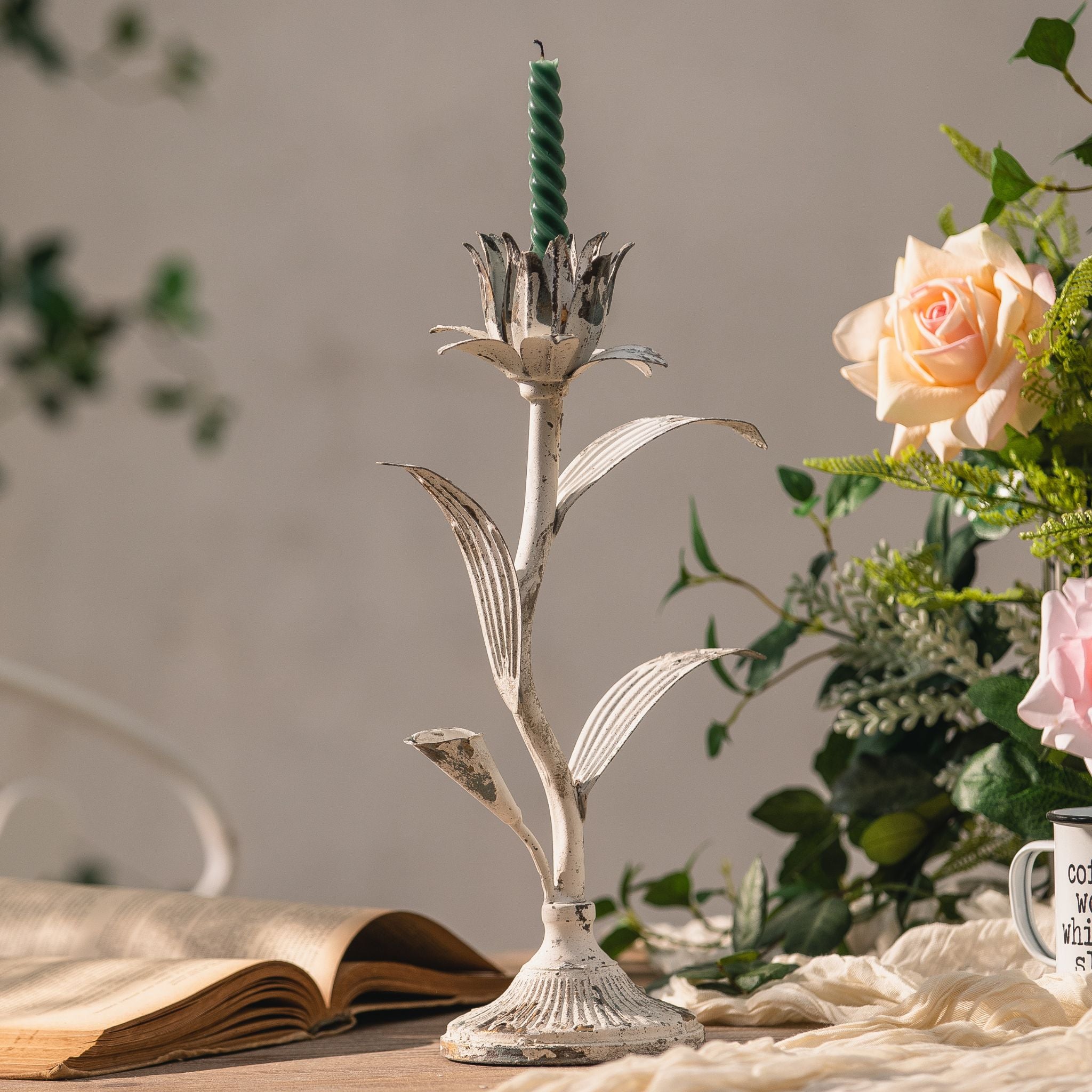 Detail of the fluted trumpet base and worn white finish on the Siena candle holder