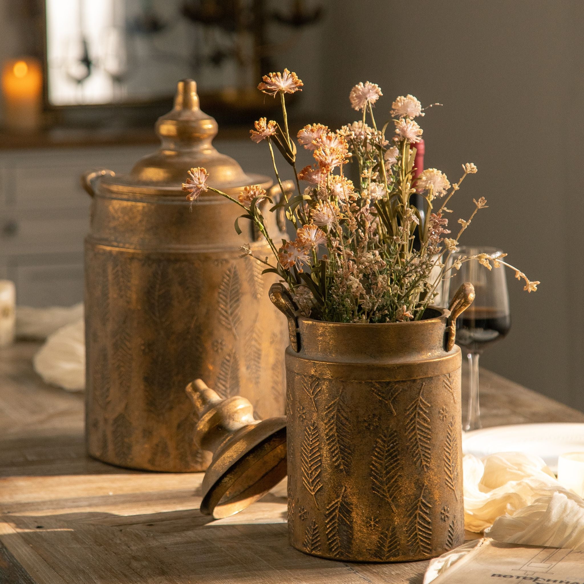 Rudi canister styled on a timber table with candlelight and dried flowers