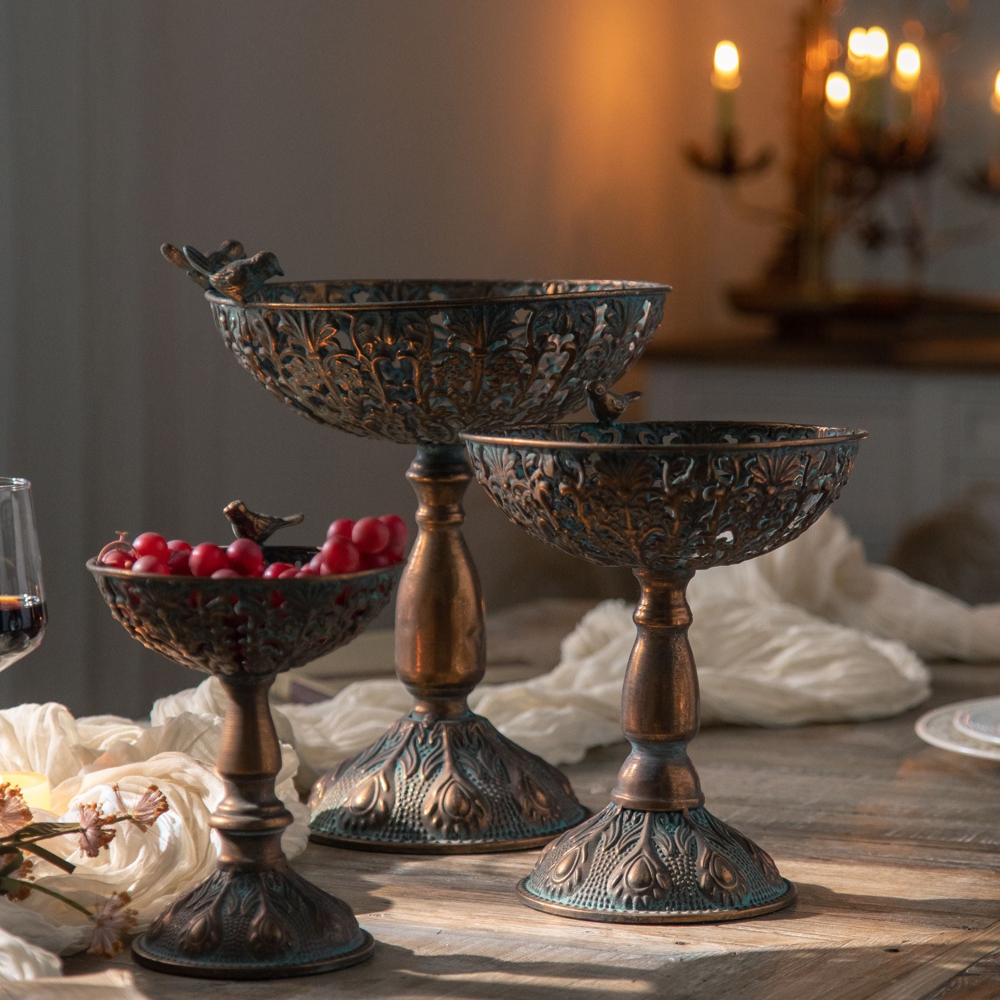 Zeno pedestal bowl filled with red berries on a timber table