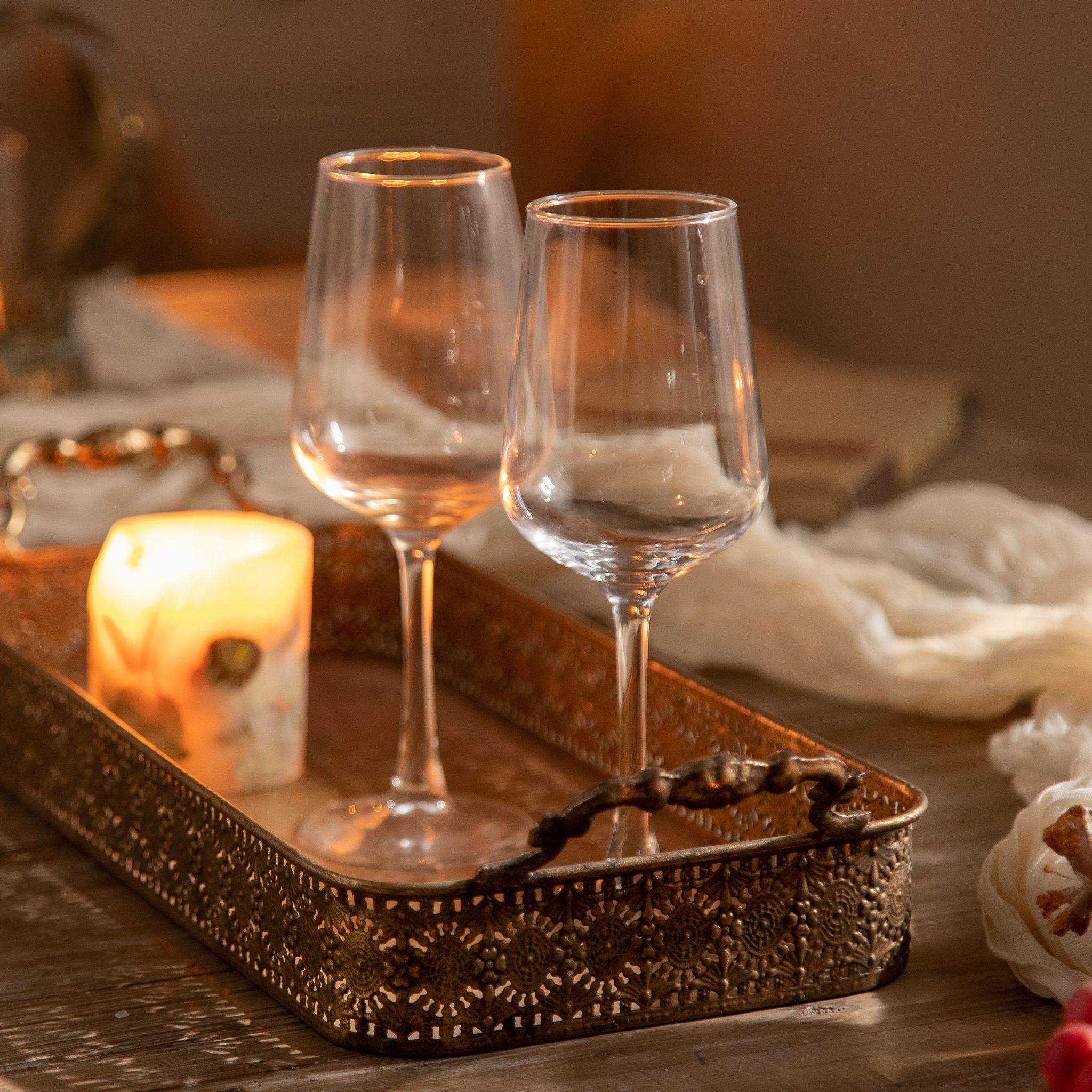 Ravello tray pair nested together with a lit candle on a timber table