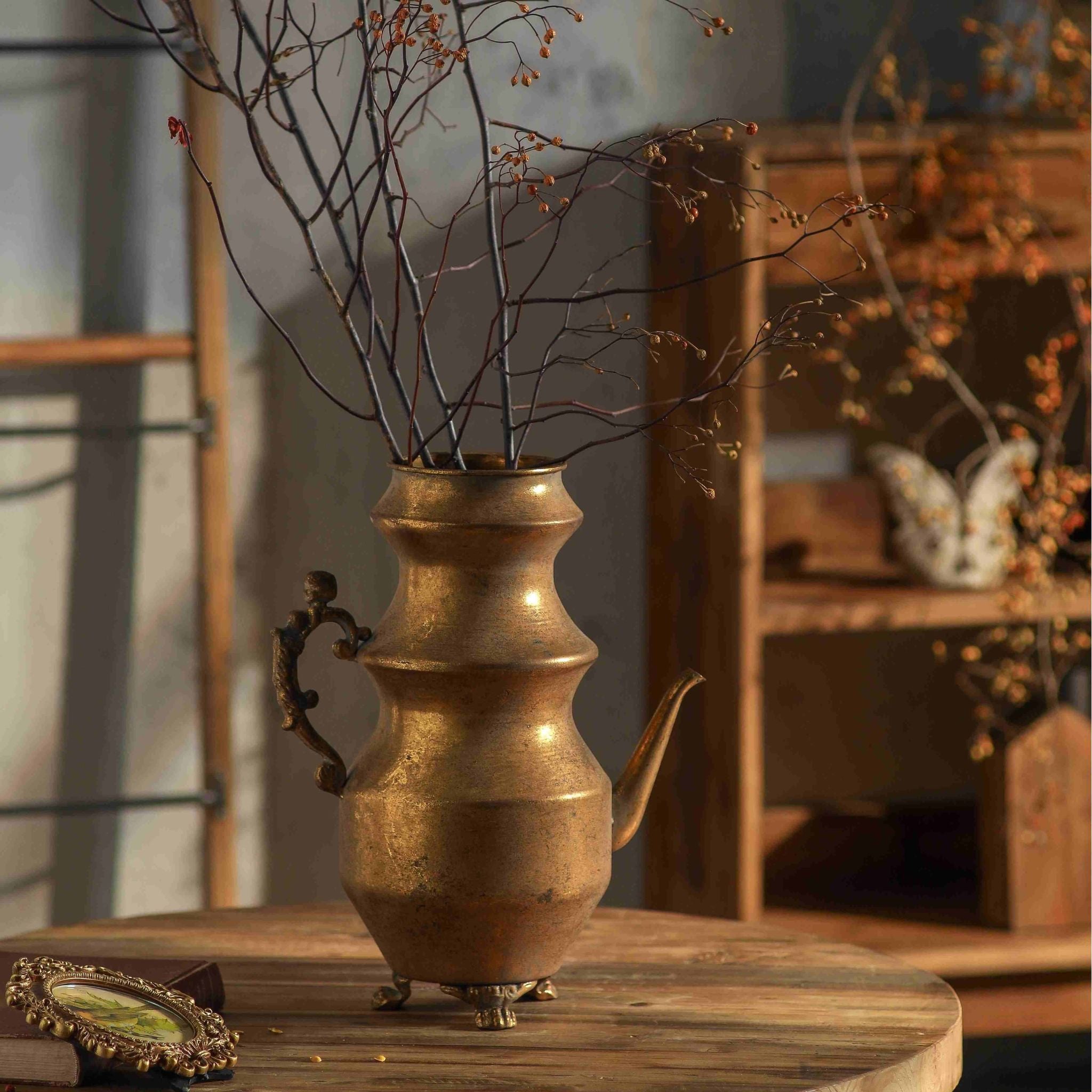 Looking into the open neck of the Ivo teapot vase showing the aged gold patina