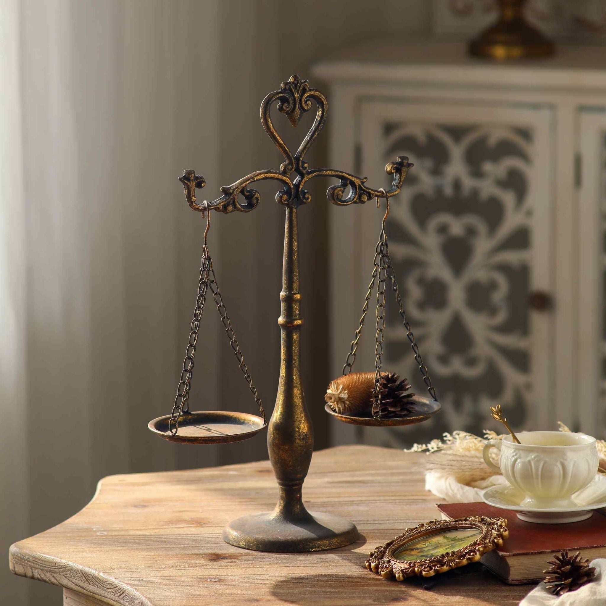 Detail of a hanging dish on fine chains and the turned column of the Nimes scales