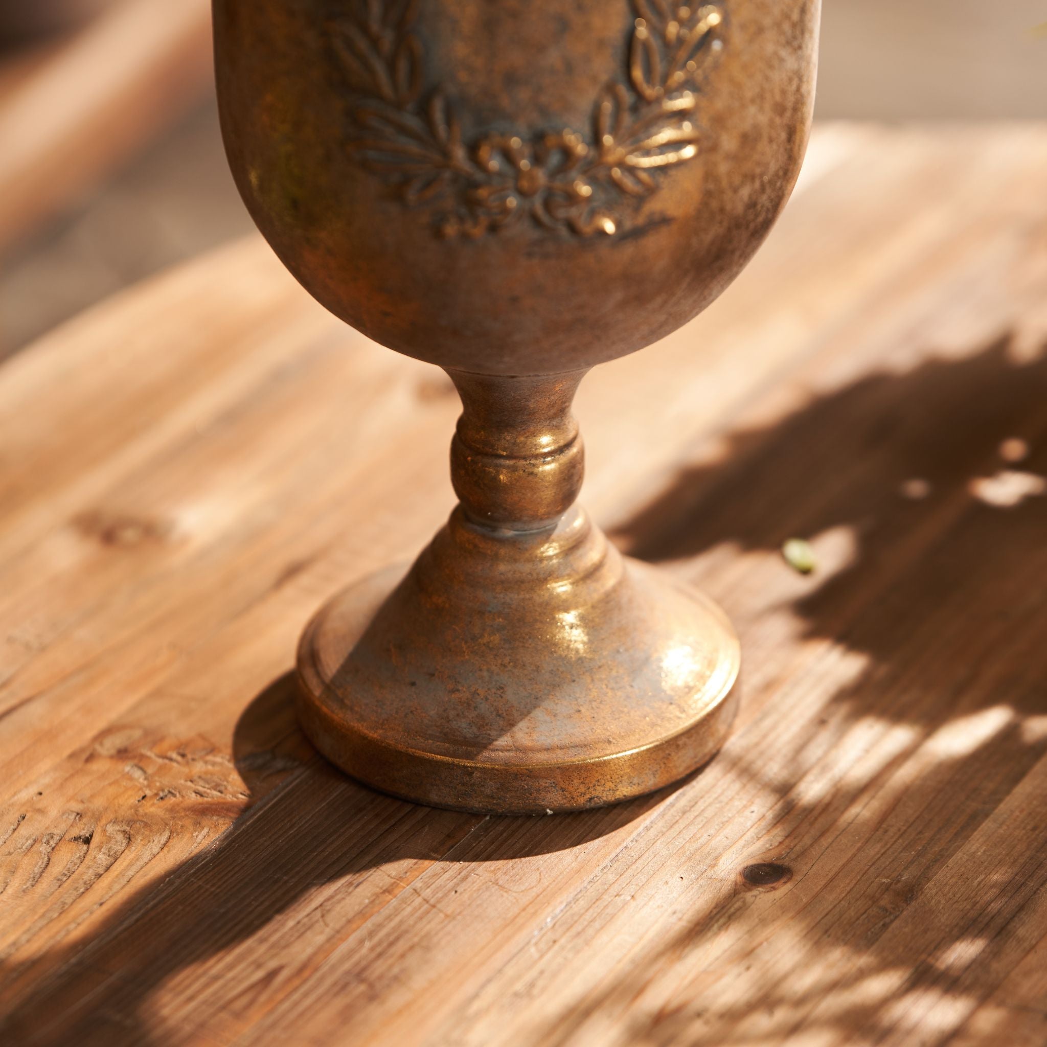 Detail of the turned ball stem and stepped foot on the Norma urn