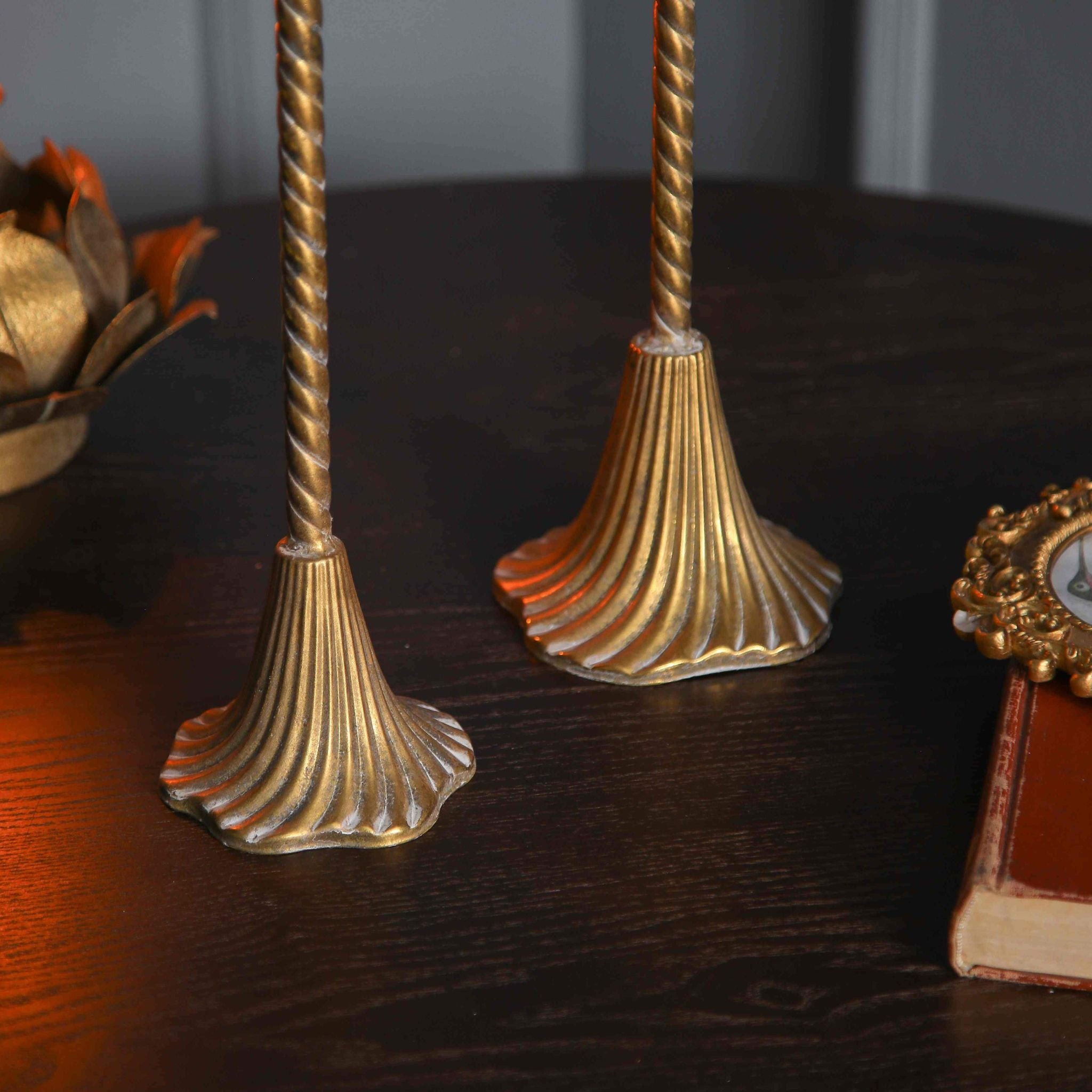 Close view of the fluted trumpet bases and twisted stems on the Alma and Amara pair