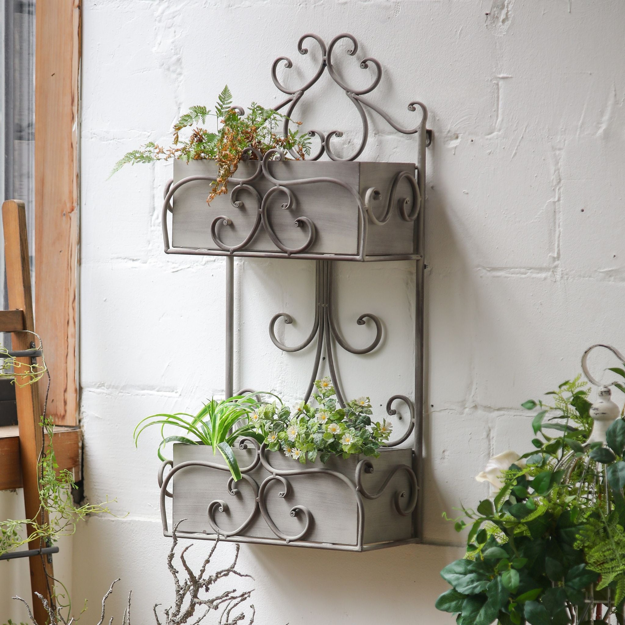 Detail of the scrolled ironwork and deep trough box on the Avignon wall planter