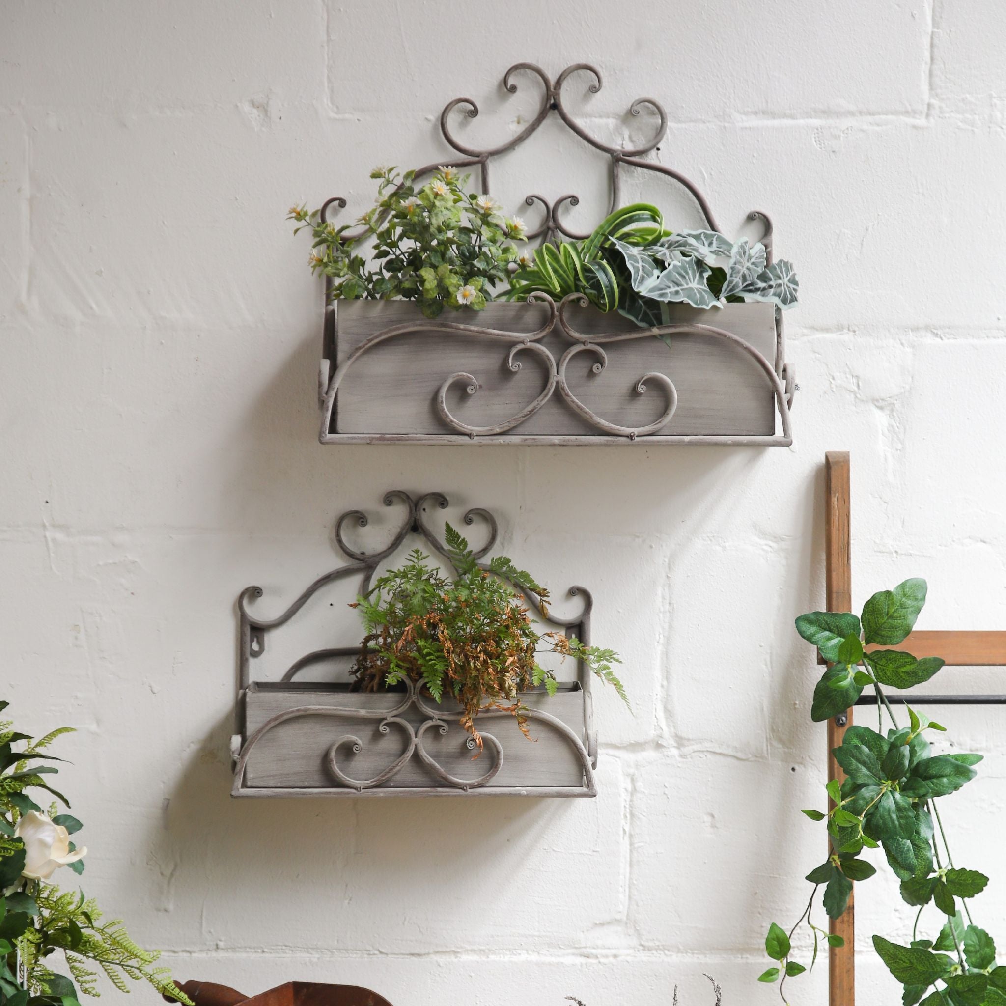 Detail of the scrolled ironwork and keyhole mount on the Bianca wall planter
