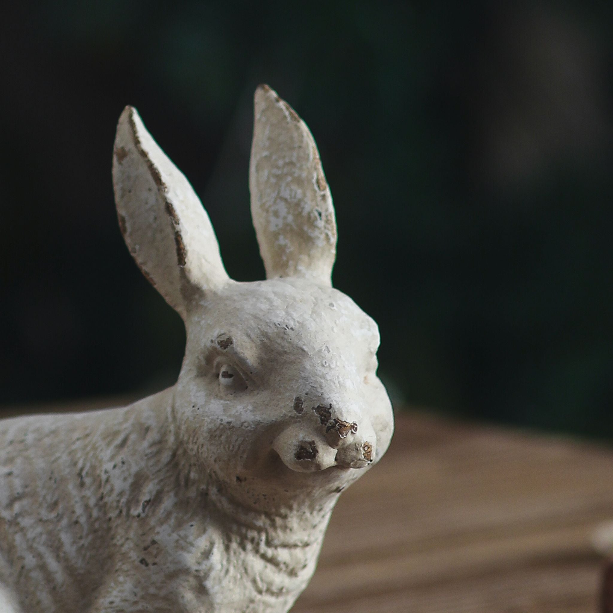 Delos rabbit sculpture with the rabbit family gathered on a table