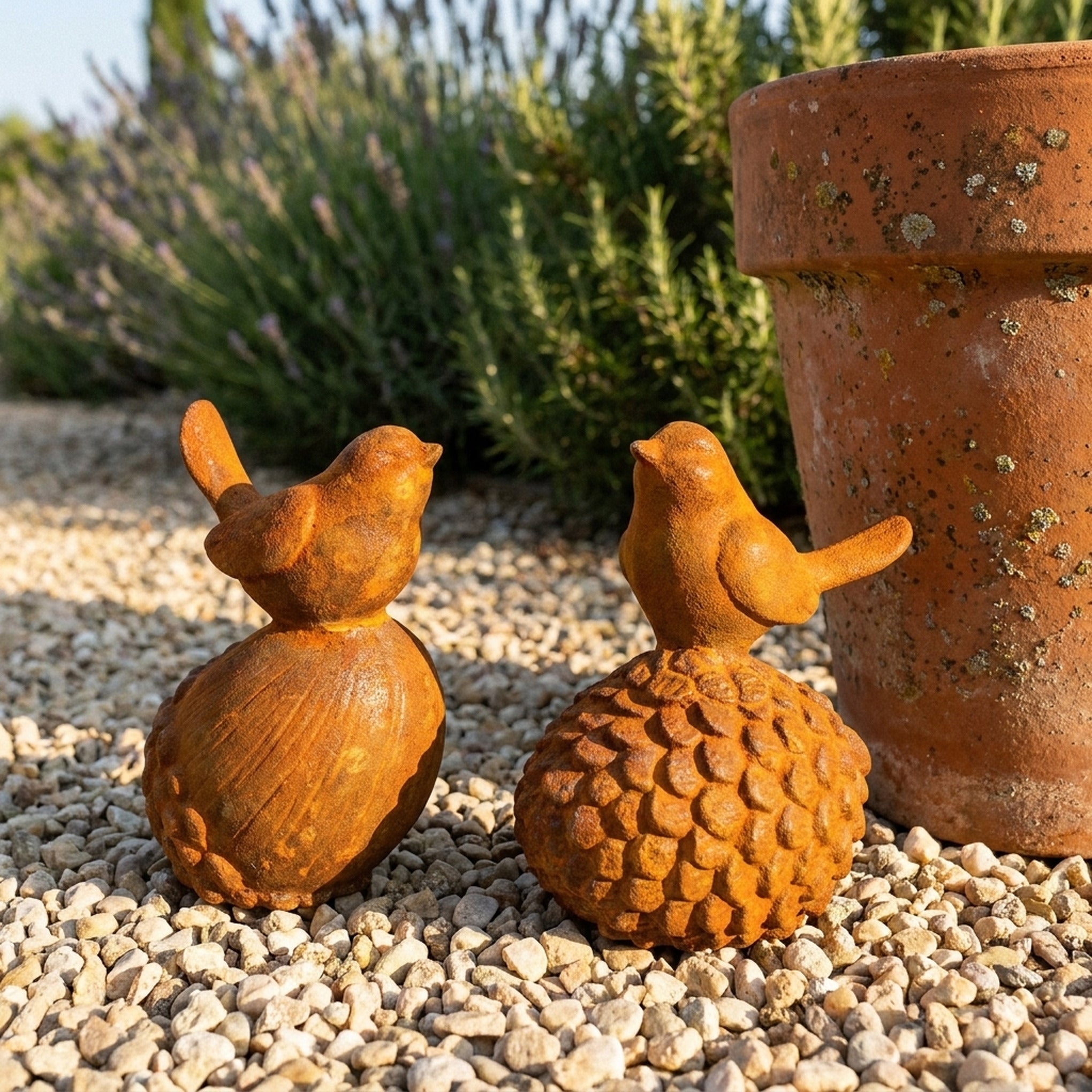 Robin and Sparrow cast iron birds front view showing both castings together on gravel
