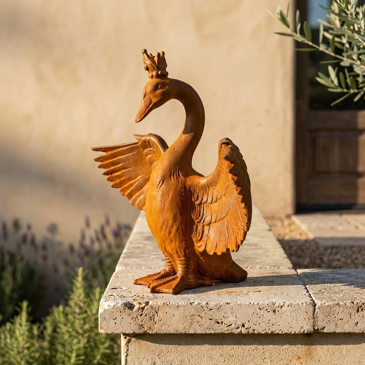 Princess Evangeline rust cast iron crowned goose statue on a travertine wall cap beside lavender