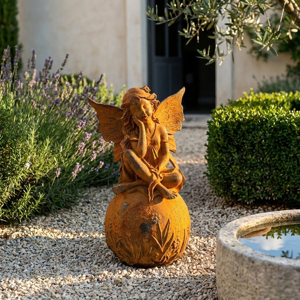 Lady Ophelia fairy statue three quarter view in a provencal courtyard