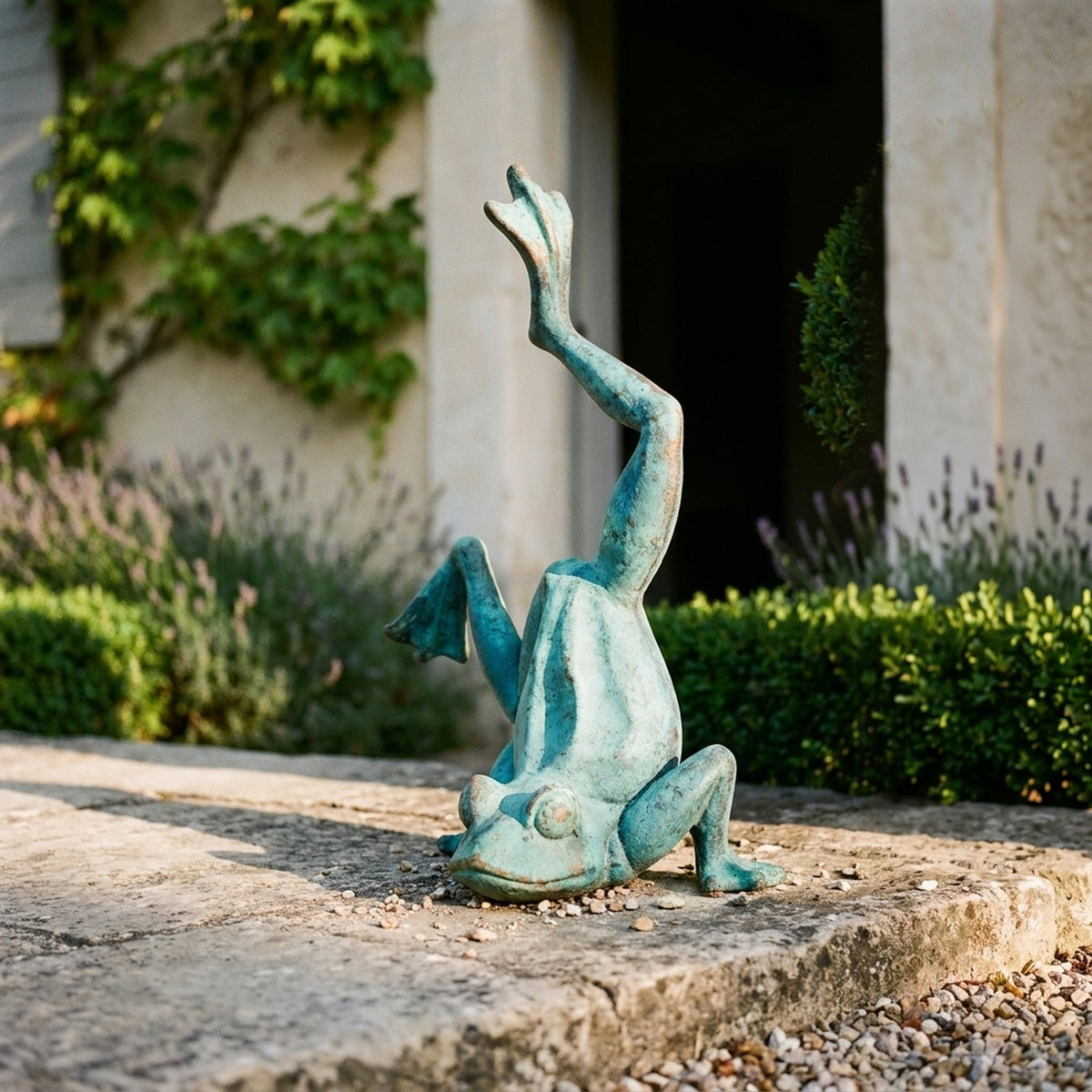 Major Ribbit in bright verdigris cast iron, doing a handstand with one leg raised
