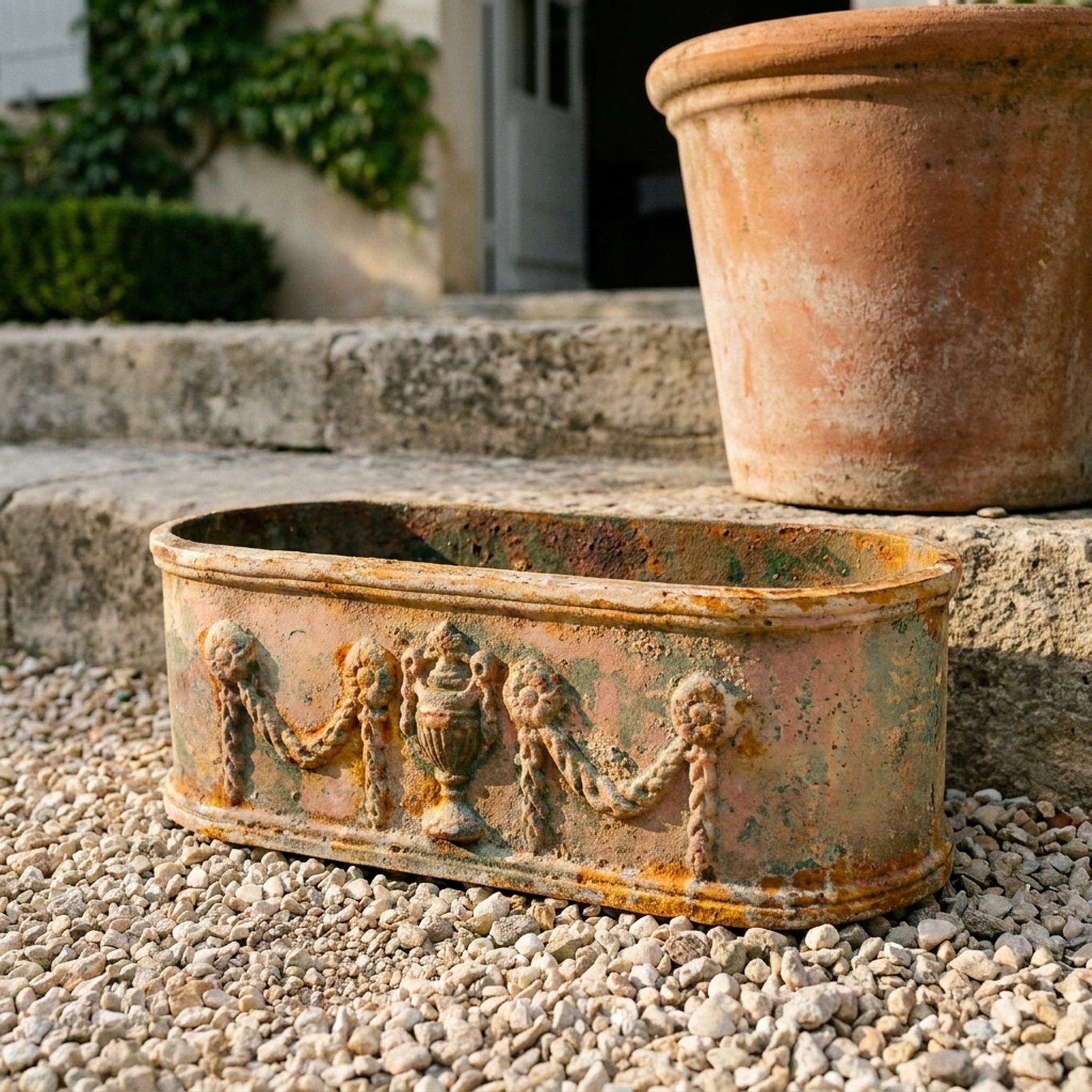 The Heritage Planter Antique close view of the urn and swag relief