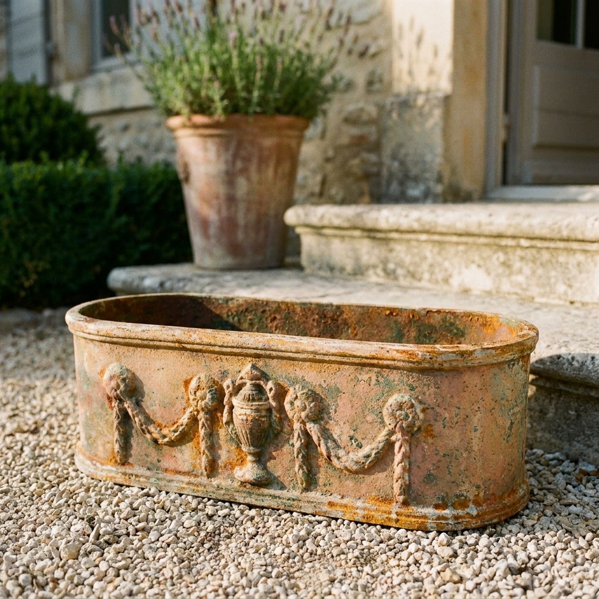 The Heritage Planter Antique close detail of the mottled rust and verdigris patina across the mouldings