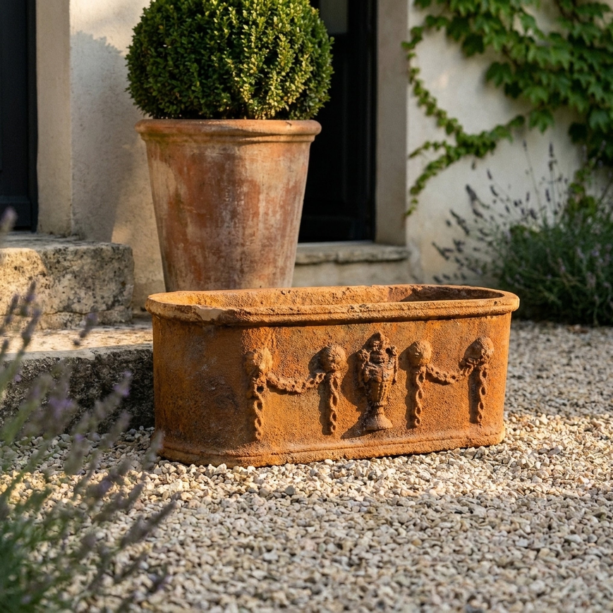 The Heritage Planter Rustic close view of the urn and swag relief