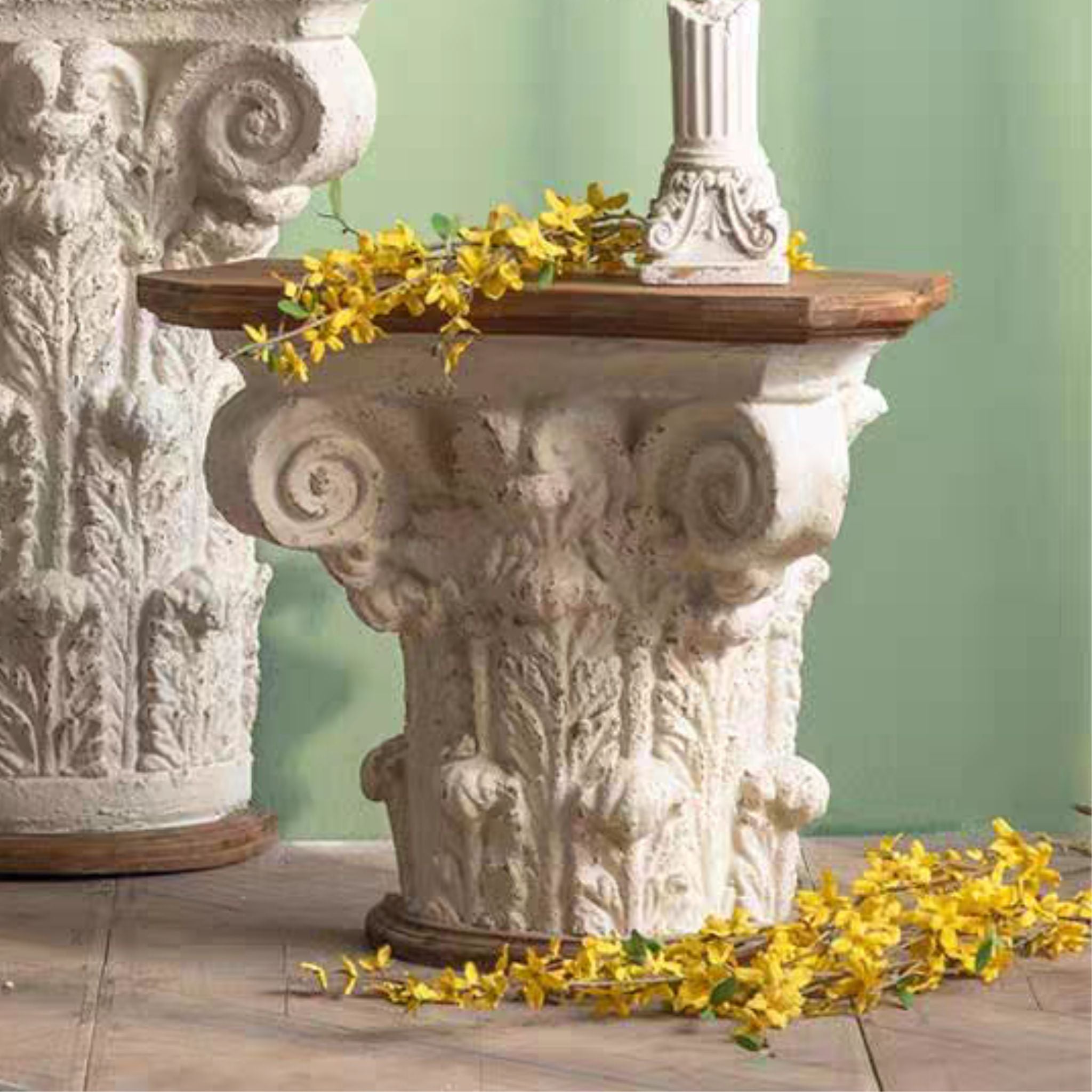 Alice Corinthian capital side table in antique-white magnesia with a fir timber top. Hero.