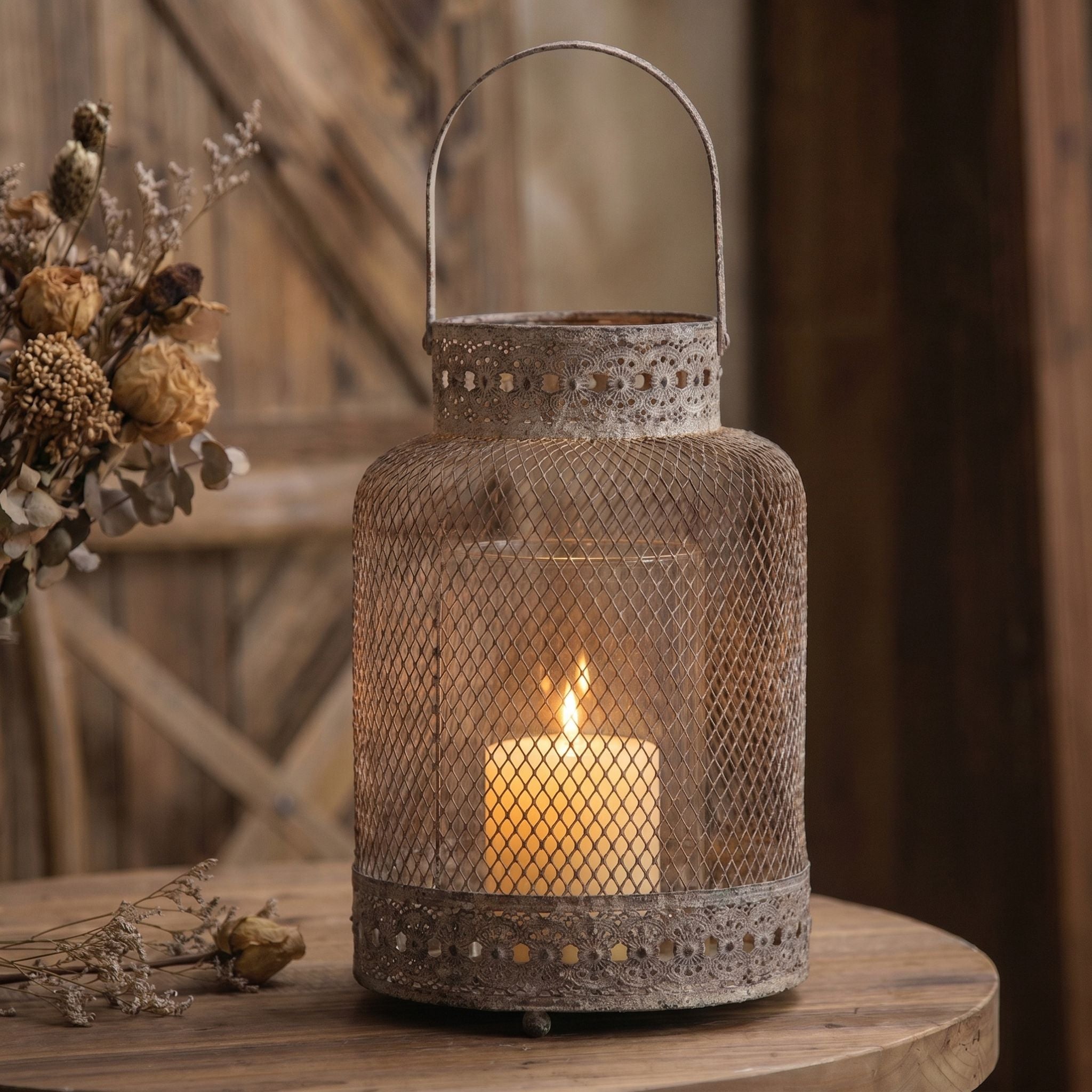 Valentine tall weathered metal mesh lantern with a candle glowing inside