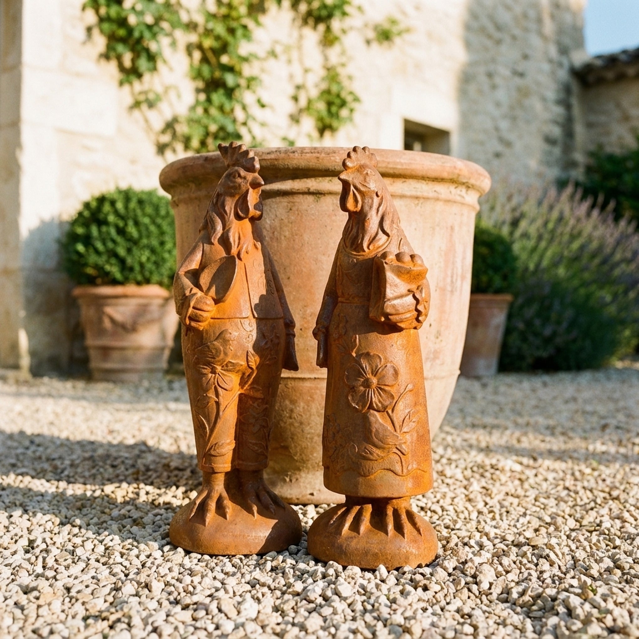Mr Featherwick and Mrs Cluckington three quarter view in a provencal courtyard