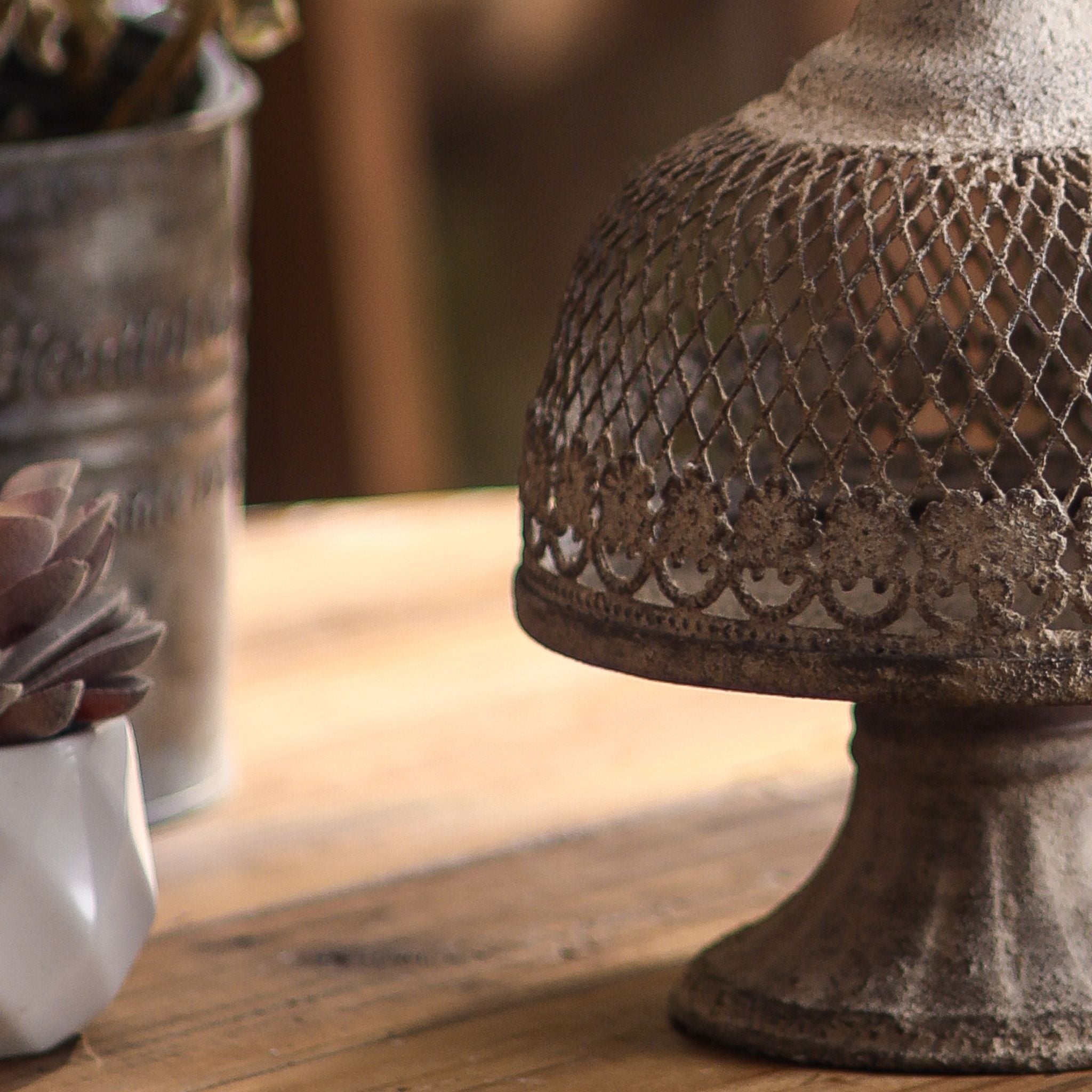 Leandro cloche close-up detail of the pressed floral band and aged stone-look finish