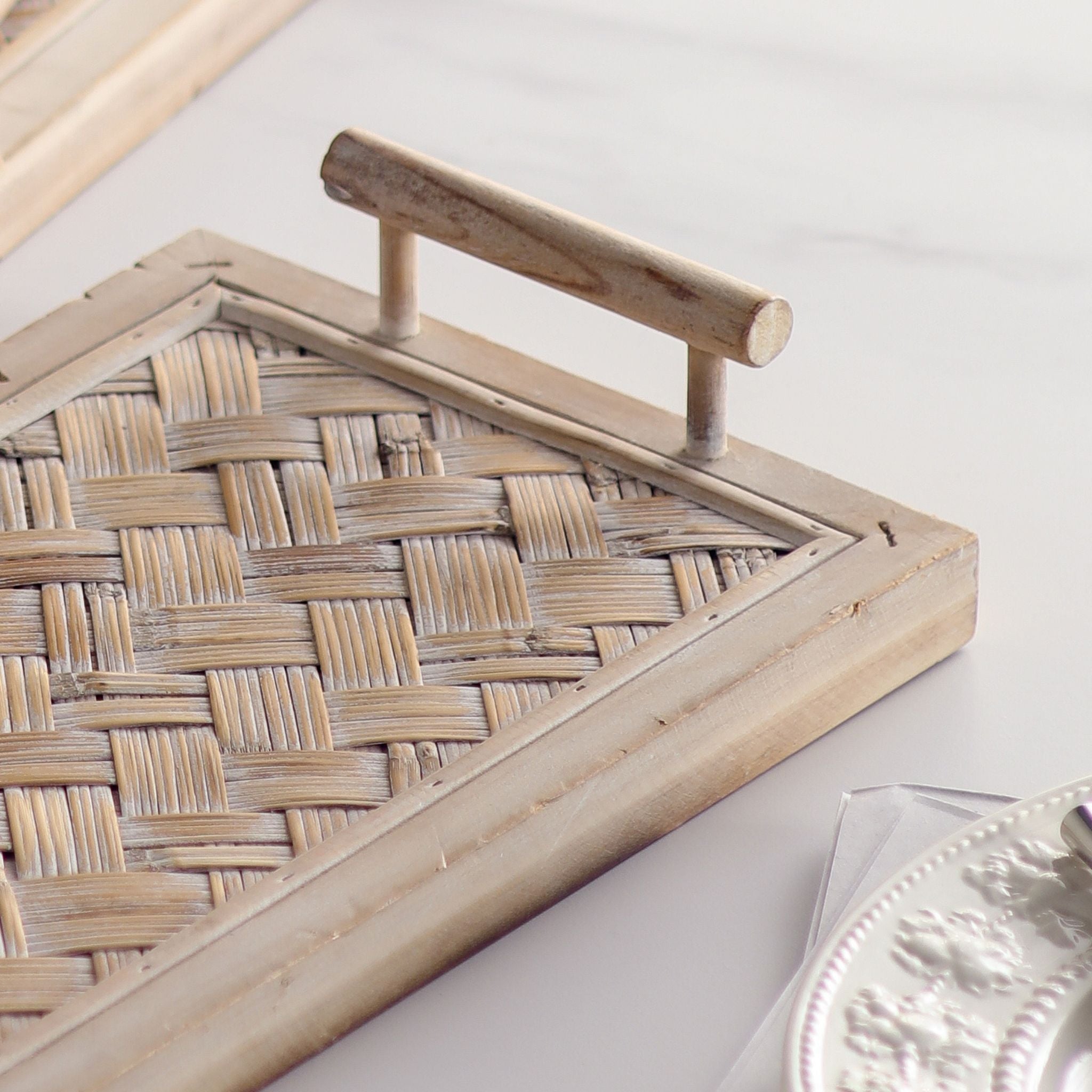 Lola tray close-up of the turned timber rail handle and woven bamboo panel