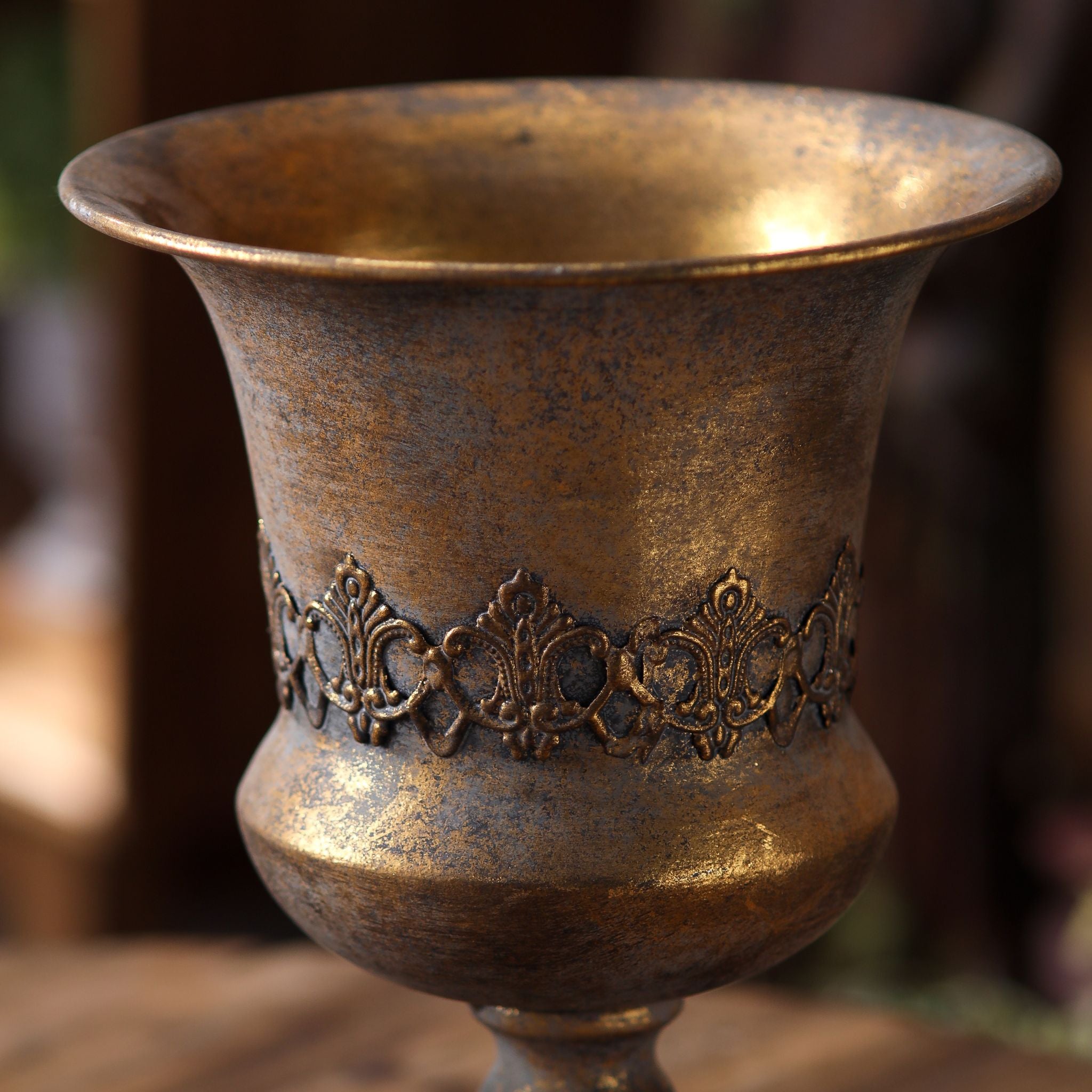 Magda urn close-up of the raised embossed band and aged bronze mottling
