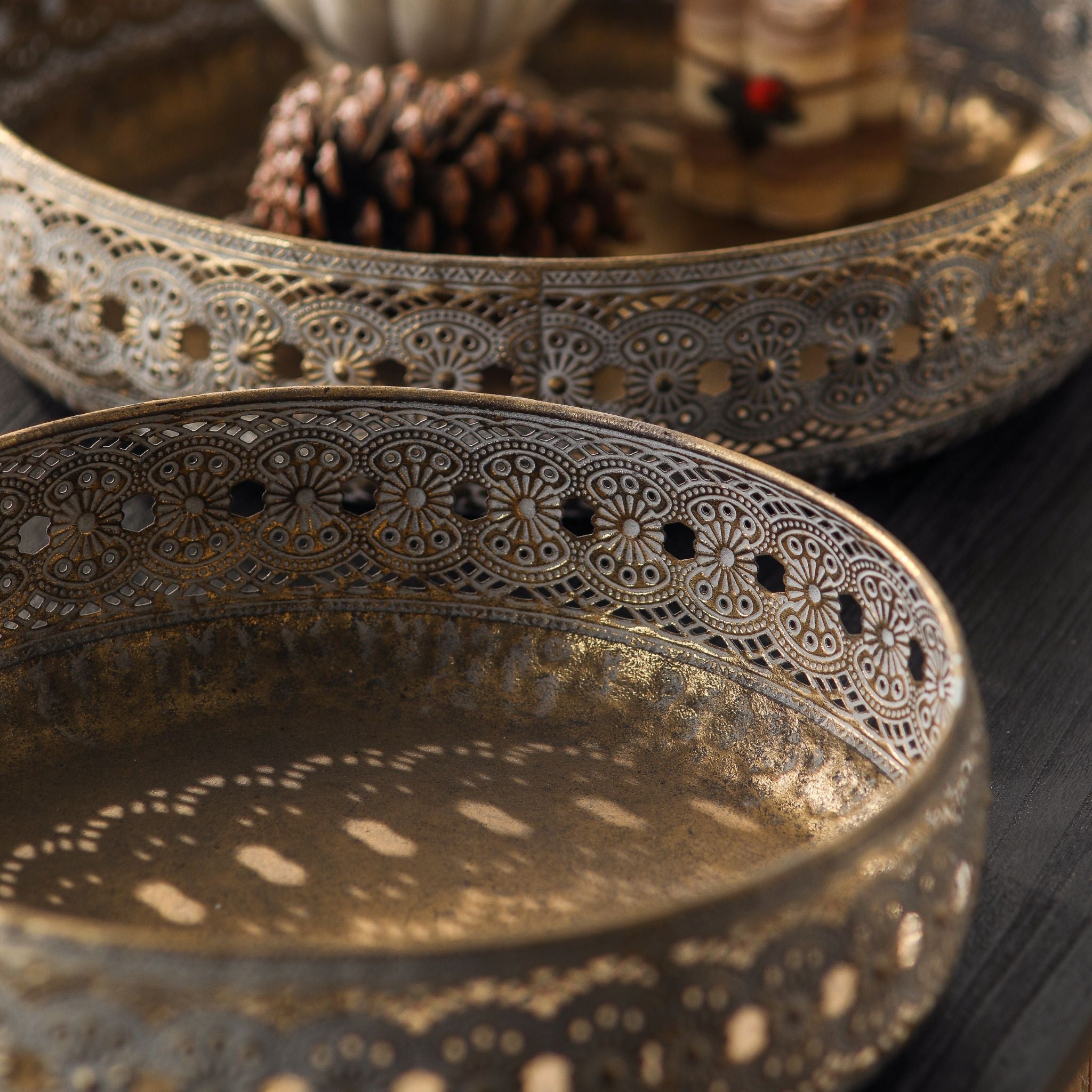 Close detail of the Abrielle trays pierced lace edge with light passing through the cut-out band