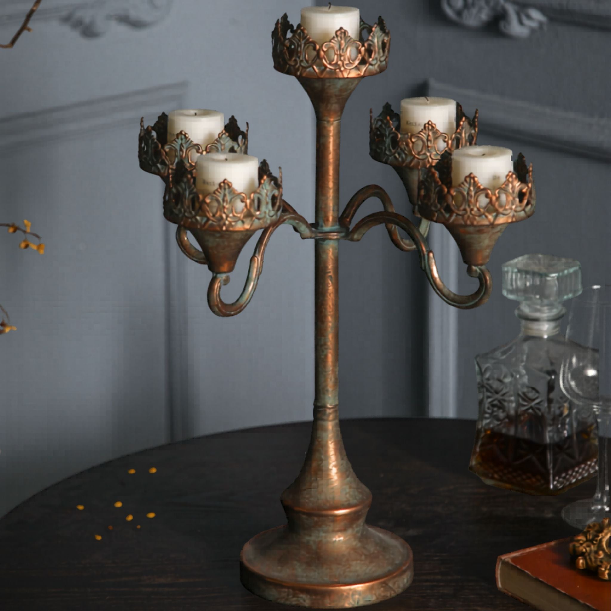 Side view of the Corrine five-light antique gold candelabra with verdigris patina.