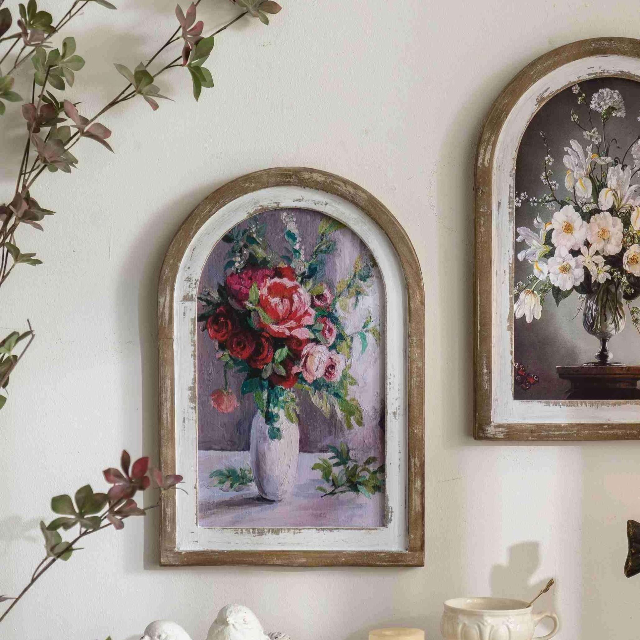 Angled view of the Audette arched floral wall art showing the frame depth.
