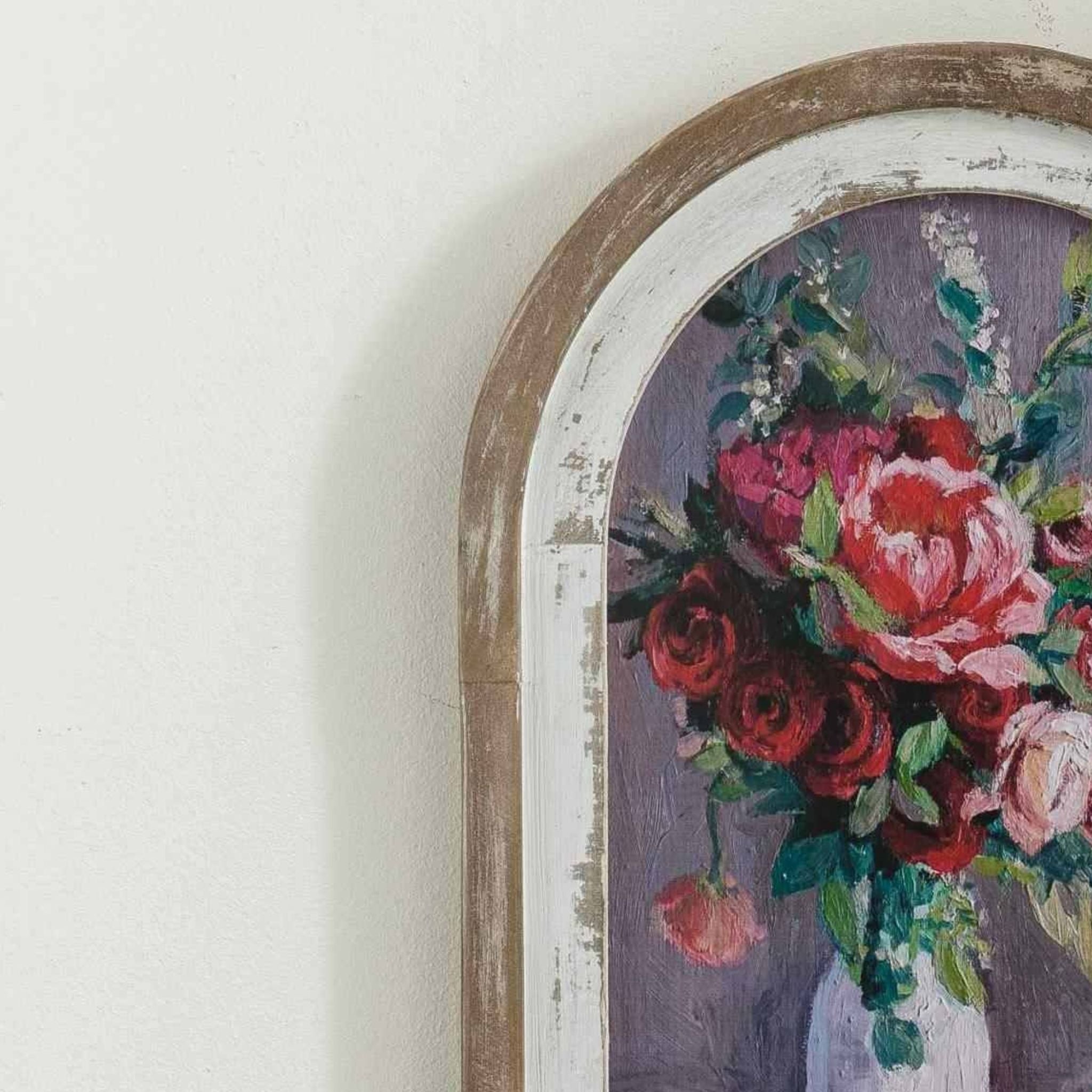Close-up of the distressed white and wood frame on the Audette arched wall art.