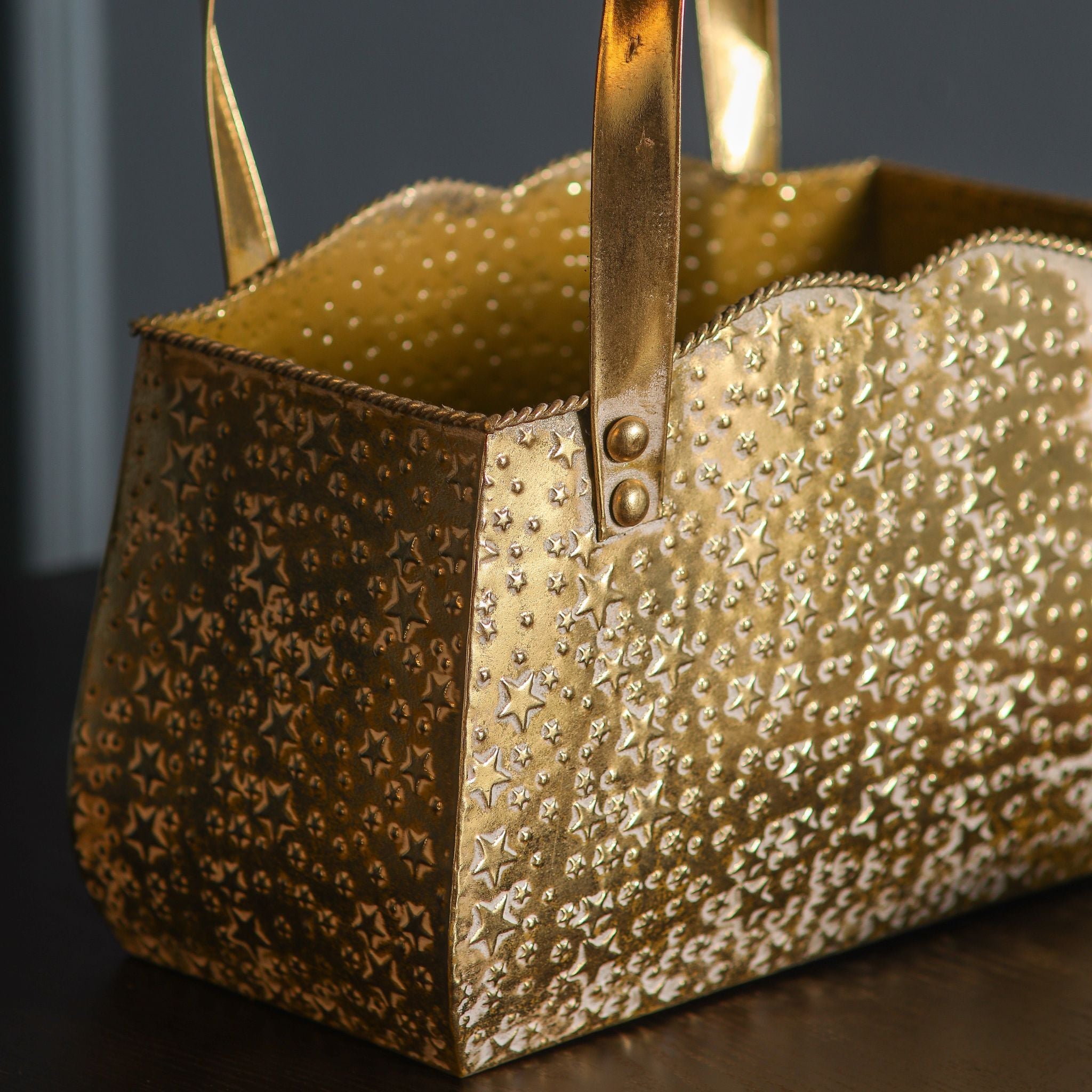 Open top of the gold handbag planter showing the star-embossed metal and twisted rope rim