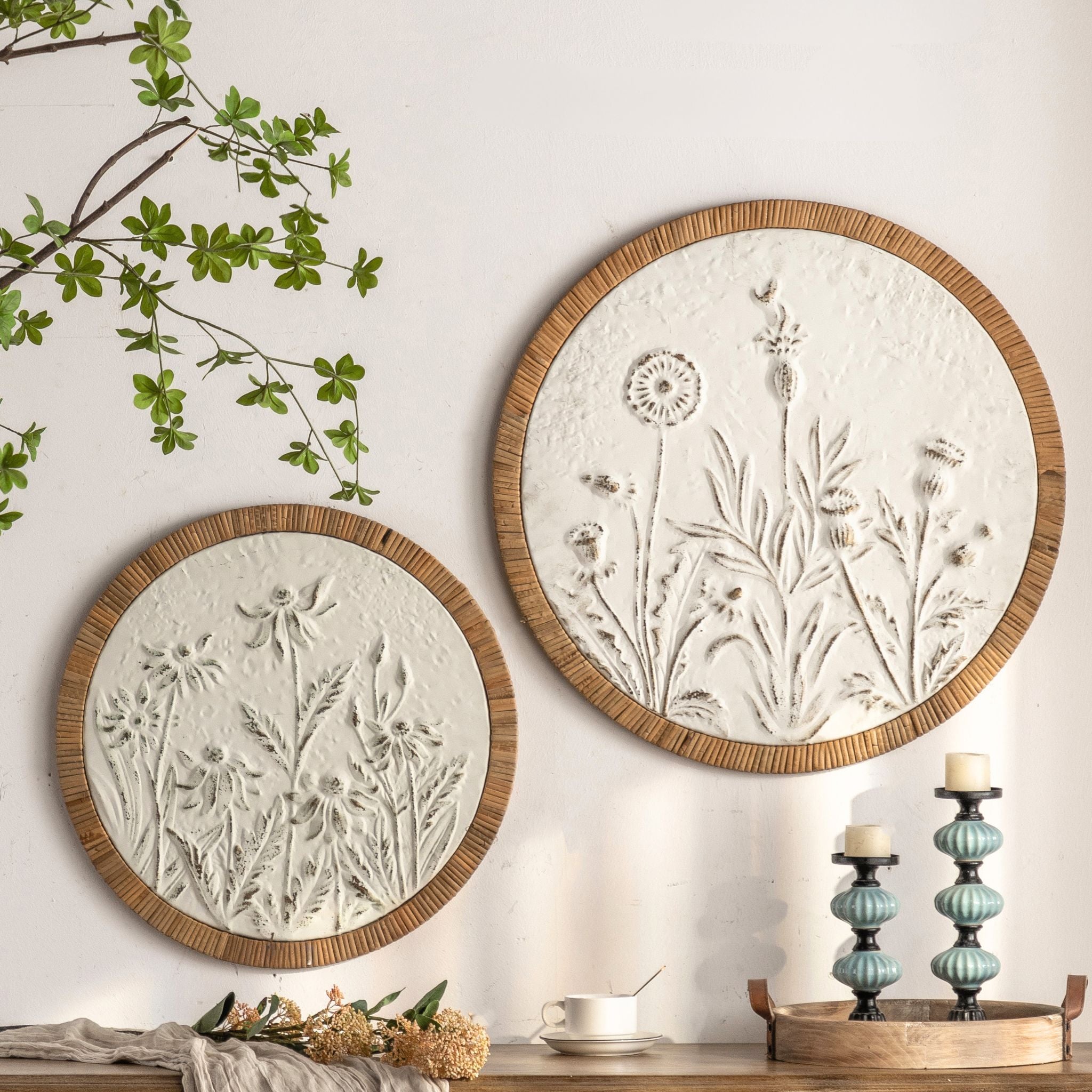 The Calvin round wall art styled on a wall beside its larger companion in a French country room.