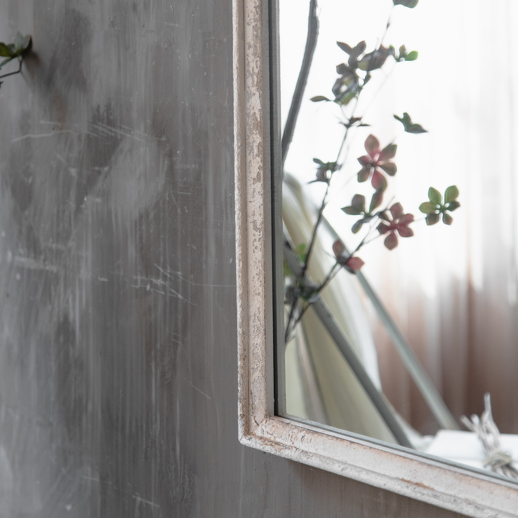 Distressed timber frame edge detail of the Camille arched wall mirror