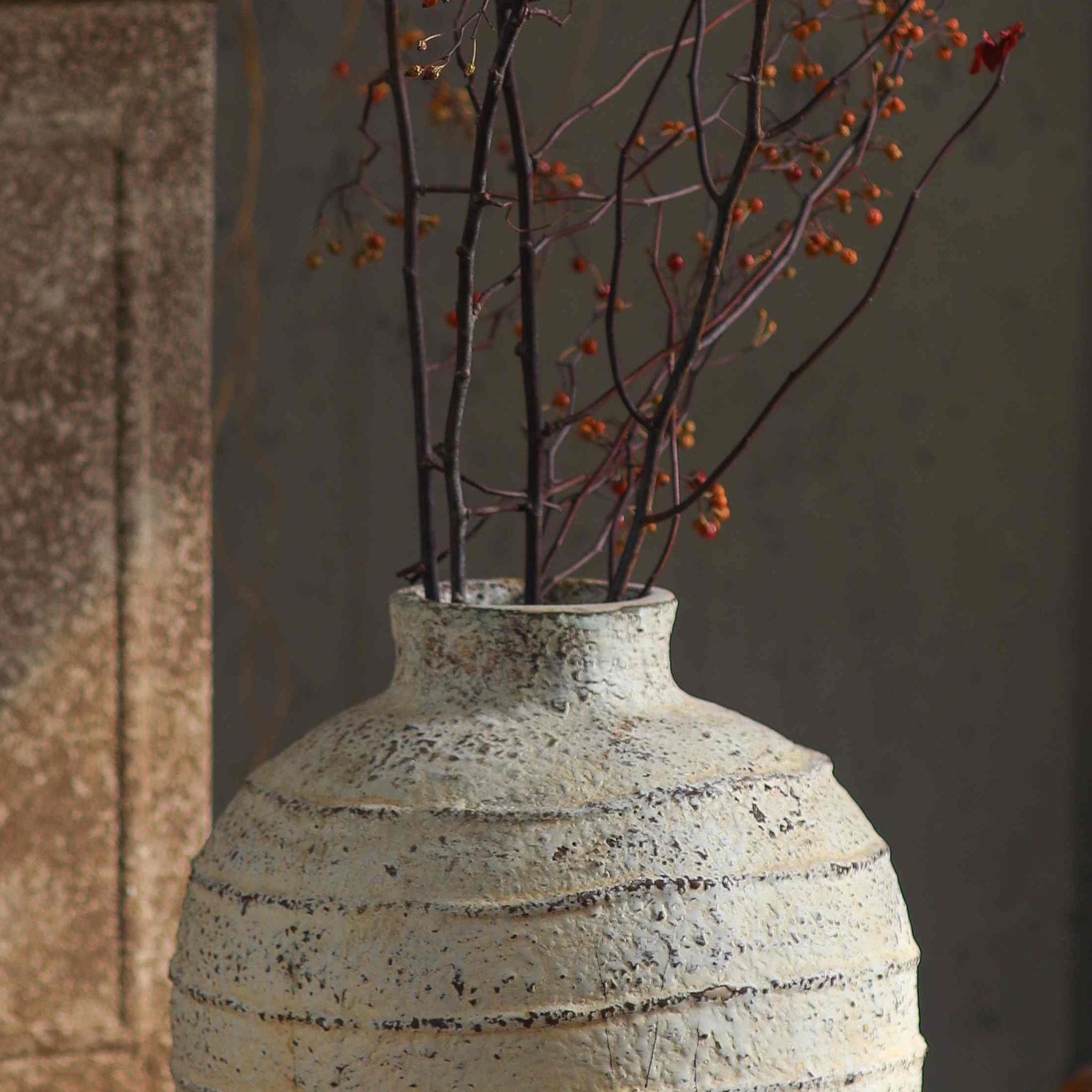 Charles ribbed vase close-up of the neck and banded texture with branches
