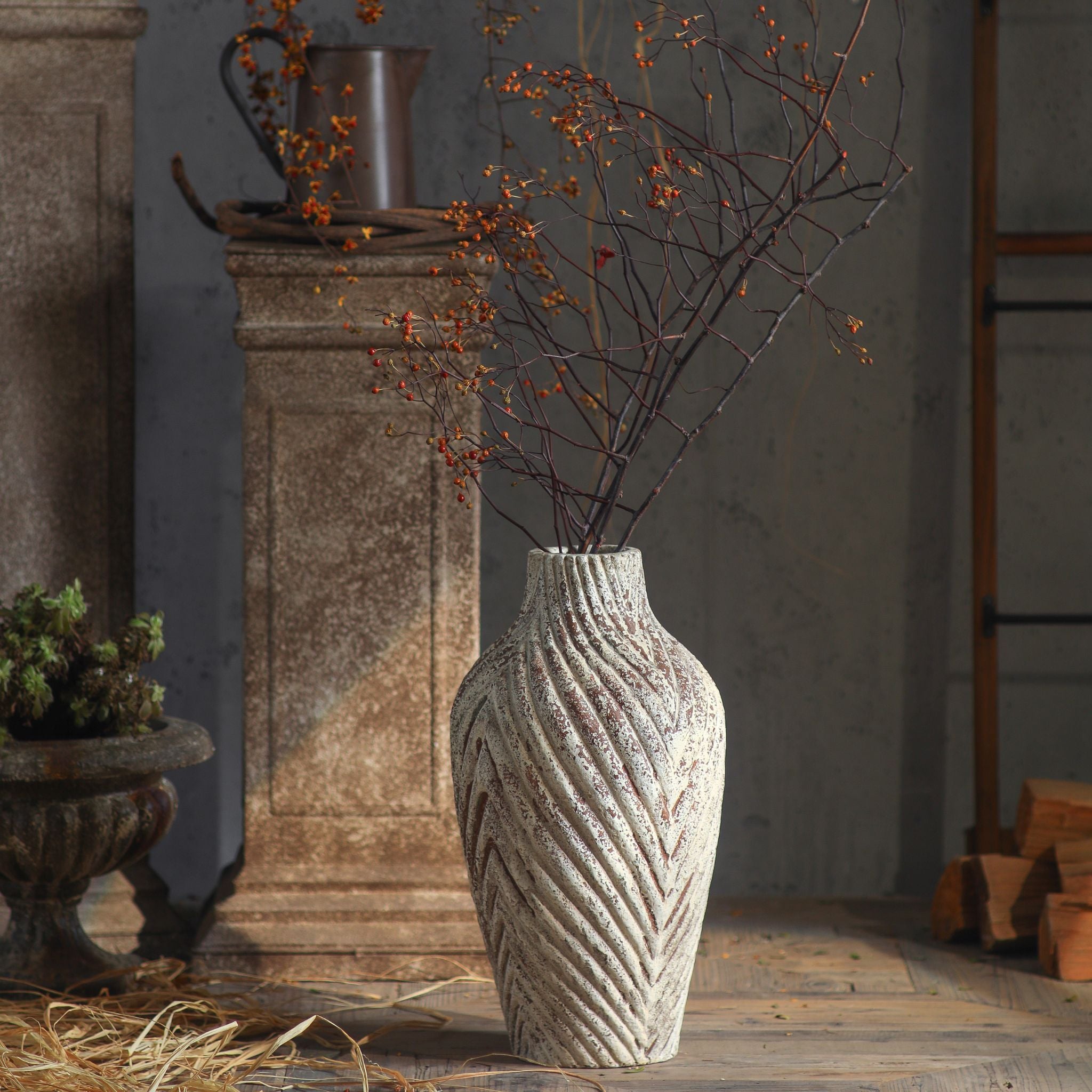 Clement chevron vase styled with bittersweet branches in a rustic interior