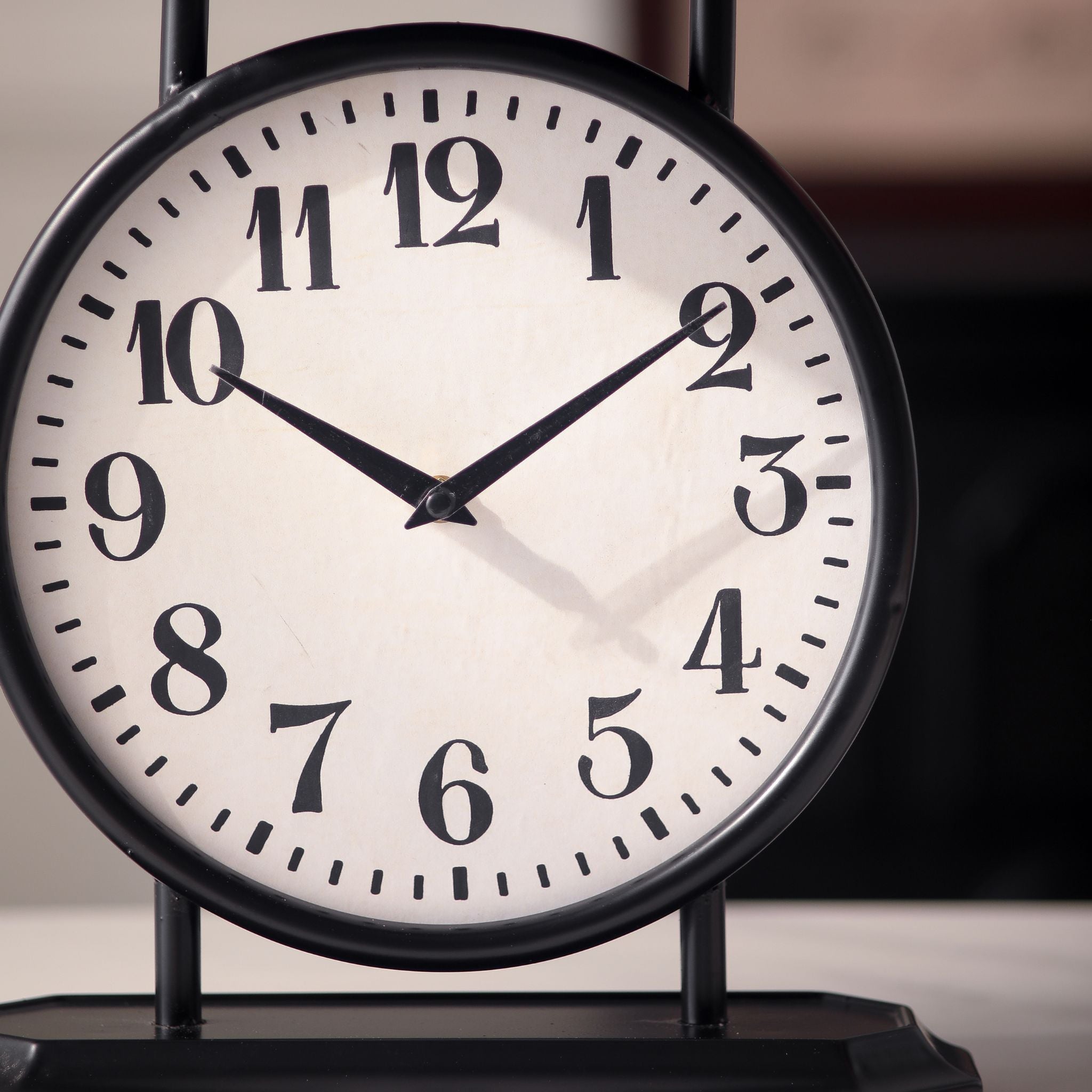 Close-up of the Patricia table clock white dial with black numerals and hands