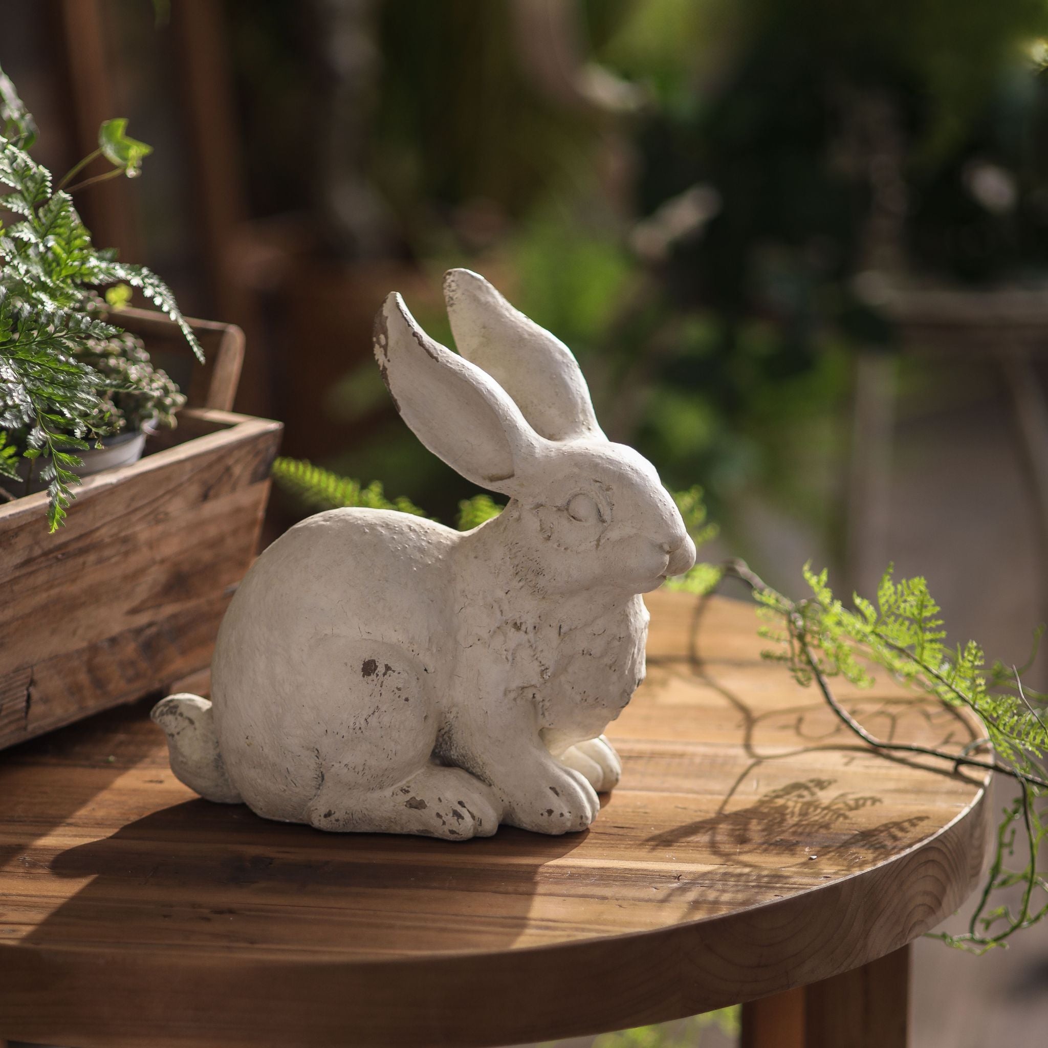 Croissant crouched rabbit statue, 22cm, low alert pose with ears upright