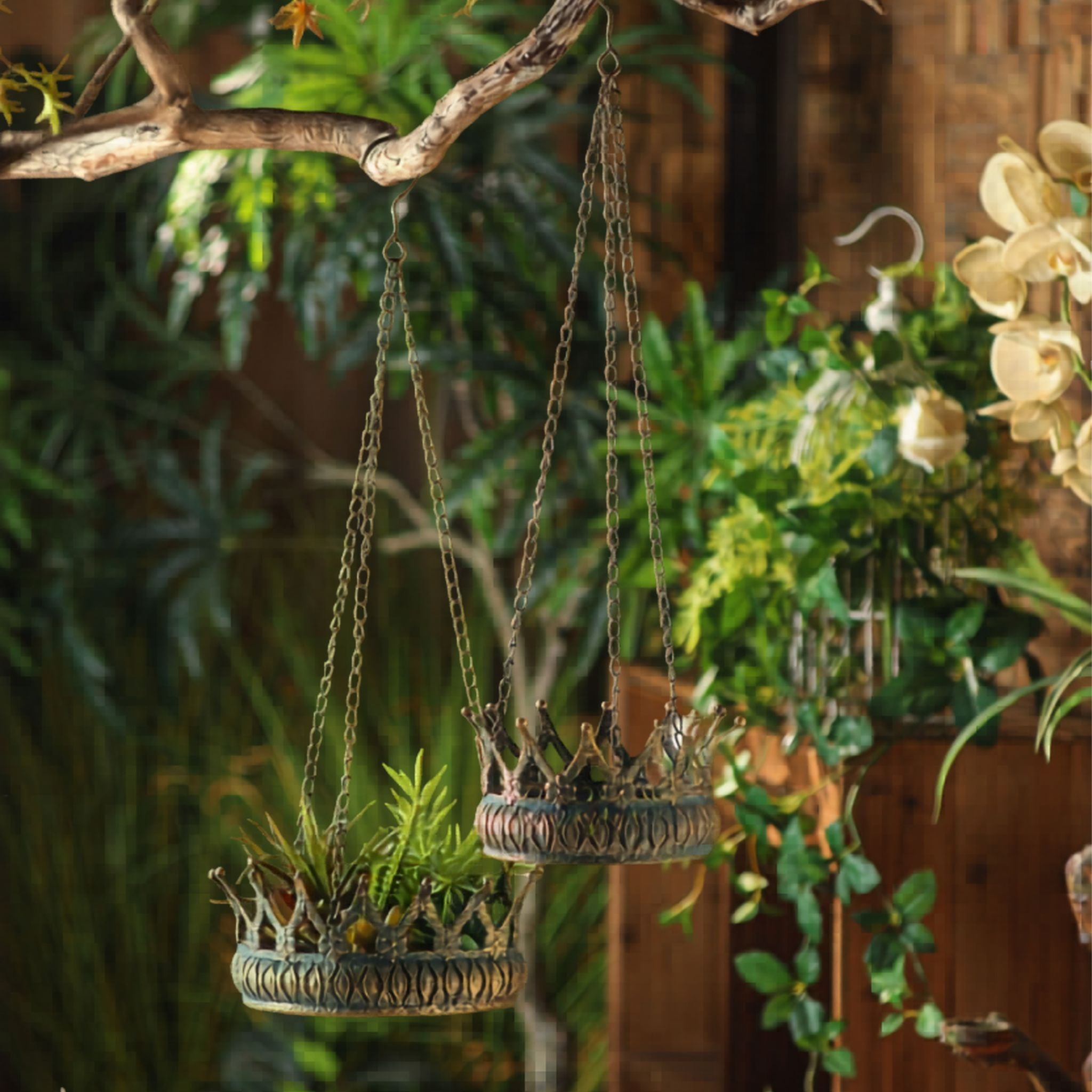 Close-up of the crown points and embossed band on the Johanna hanging planter, smaller companion below