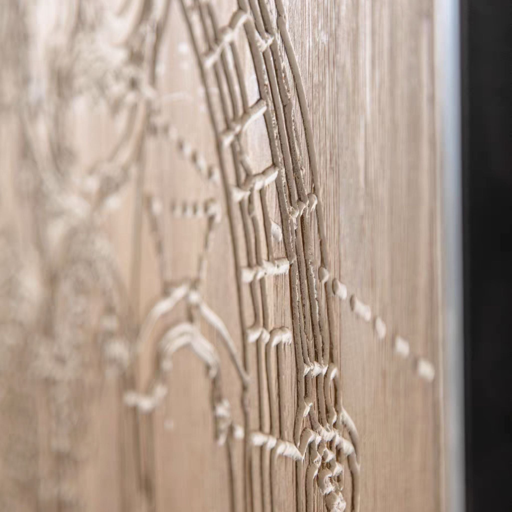Edge detail of the Darius wall art showing the slim black metal frame and raised white line work.