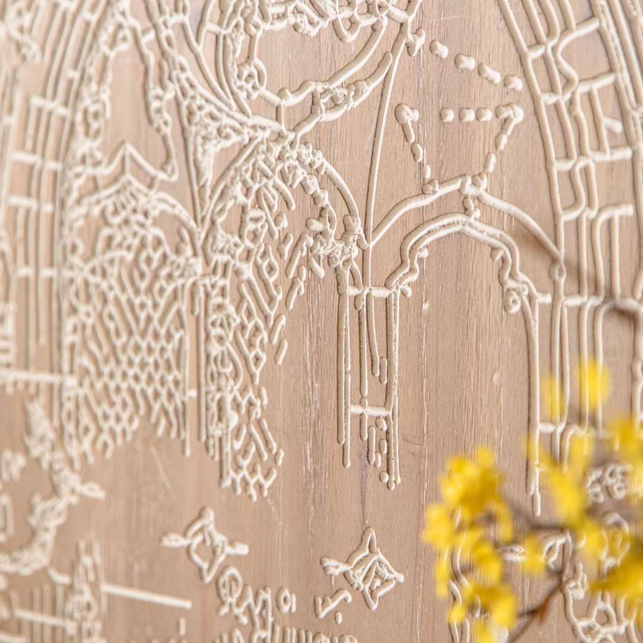 Close-up of the white architectural line drawing on the natural wood panel of the Darius wall art.