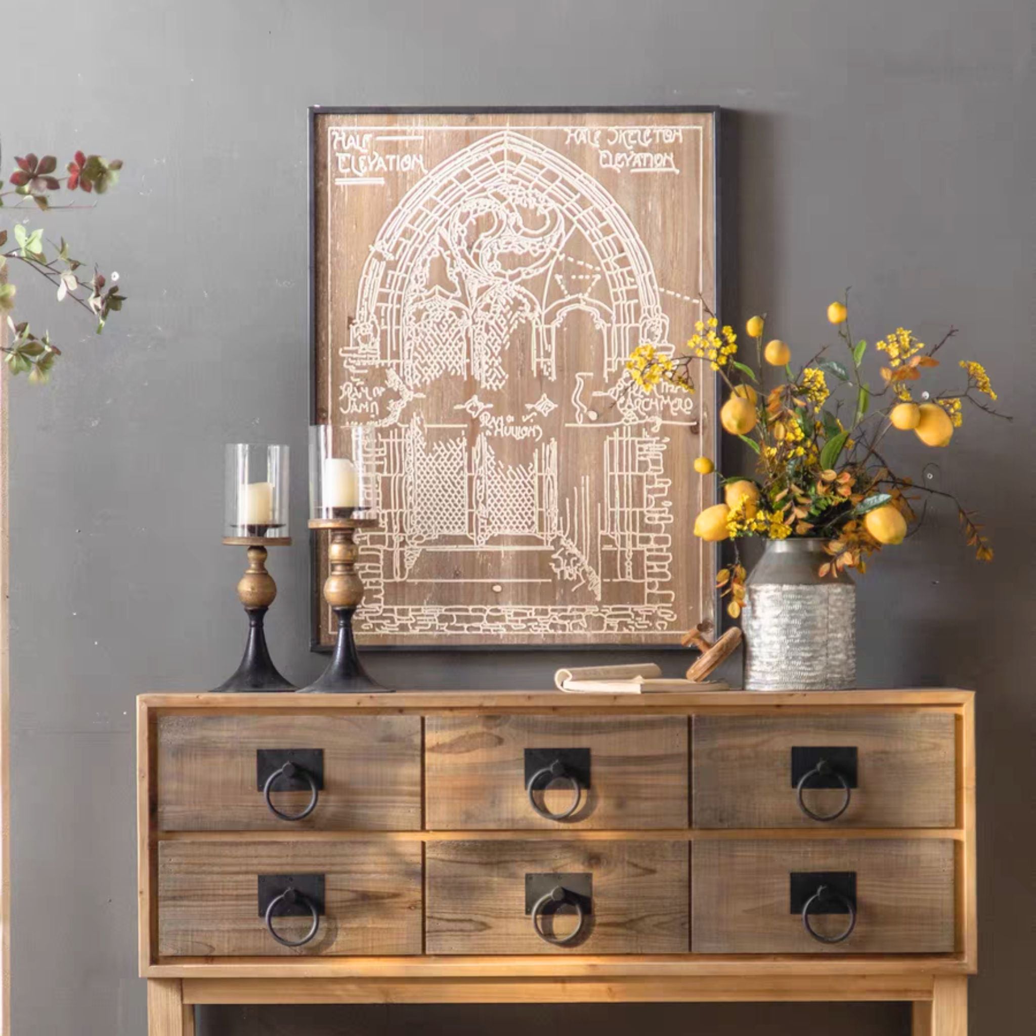 The Darius wall art leaning above a wooden console, styled in a French country room.