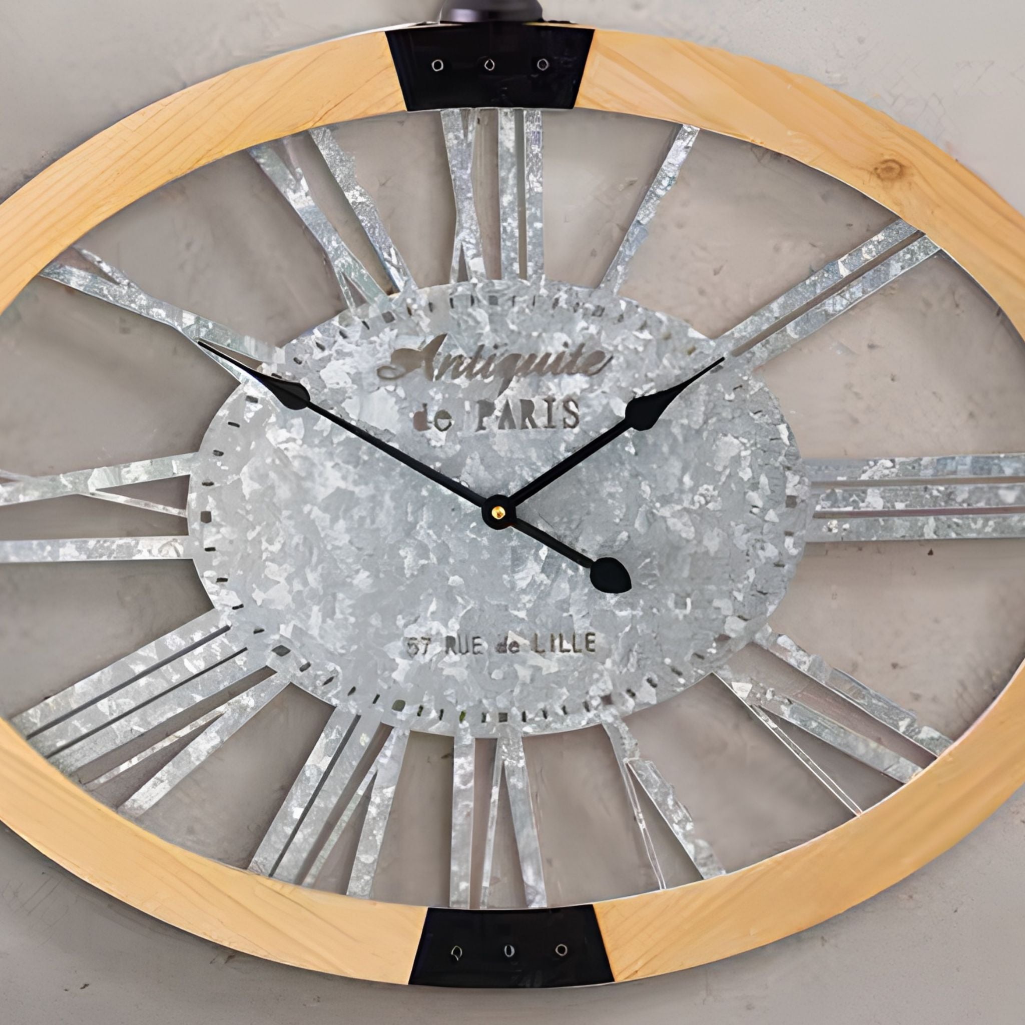 Close-up of the Maude clock galvanised dial with Roman numerals and Paris lettering