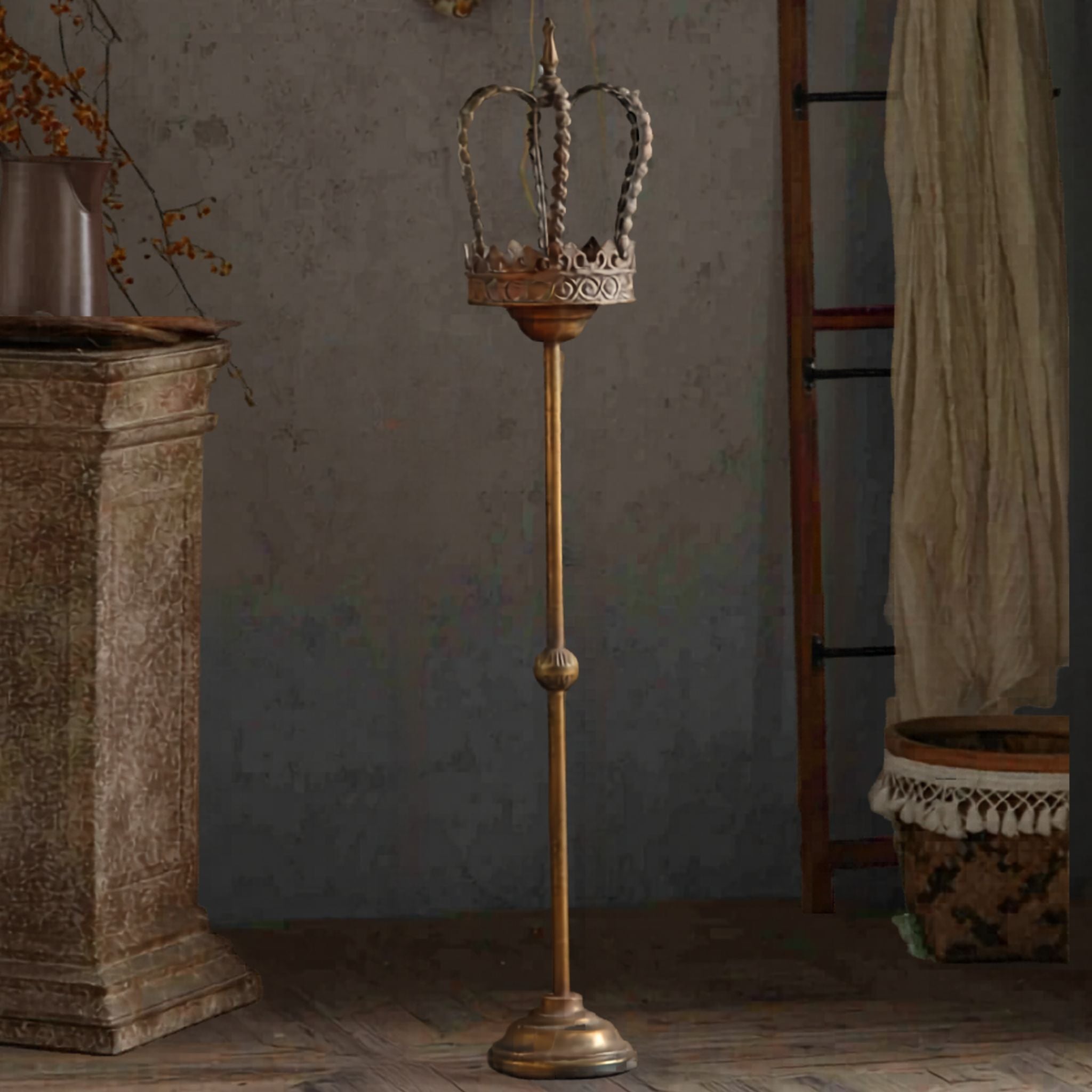 Tall aged metal crown candle stand standing over a metre high in a styled room