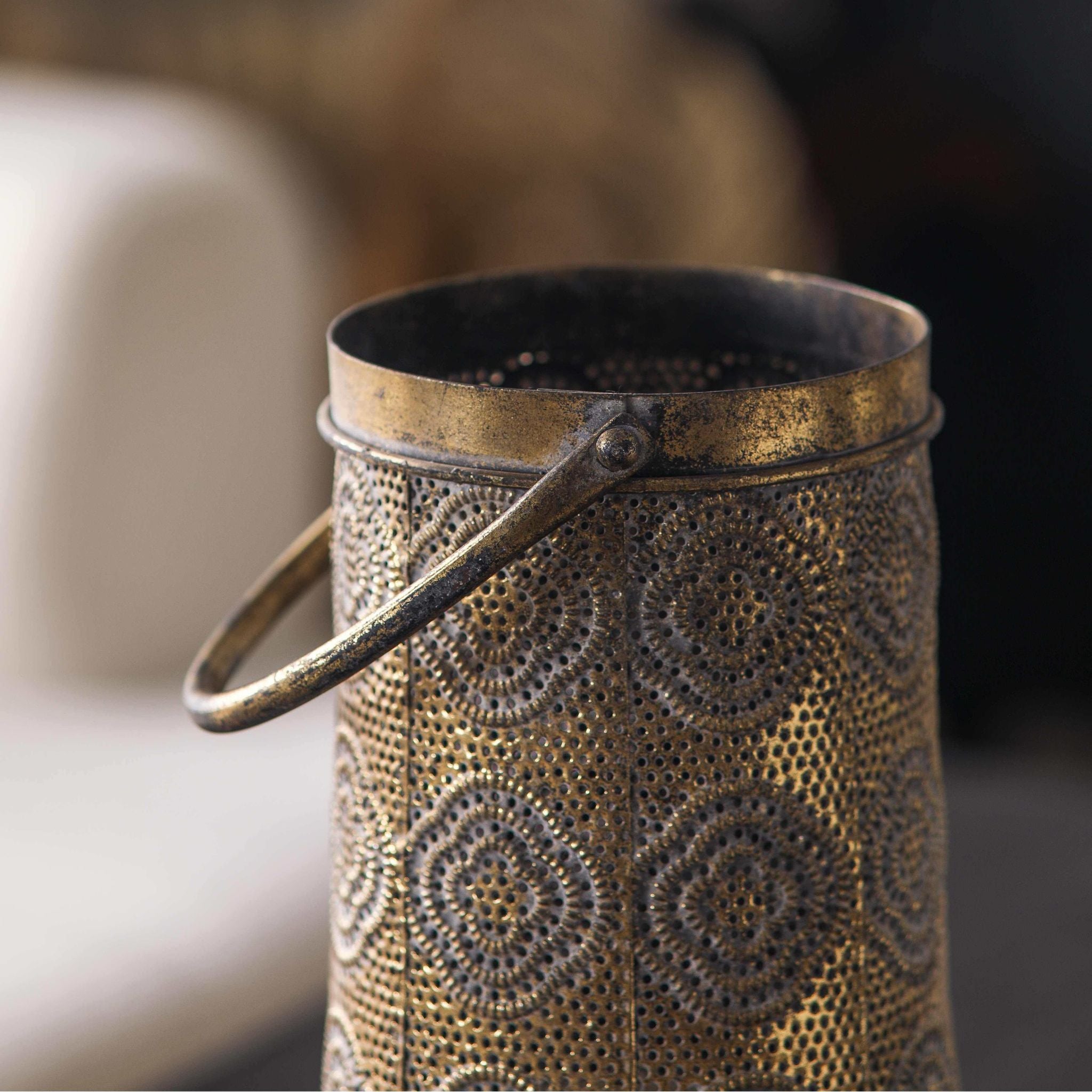 Jasmine lantern close-up of the swing handle and aged gold rim