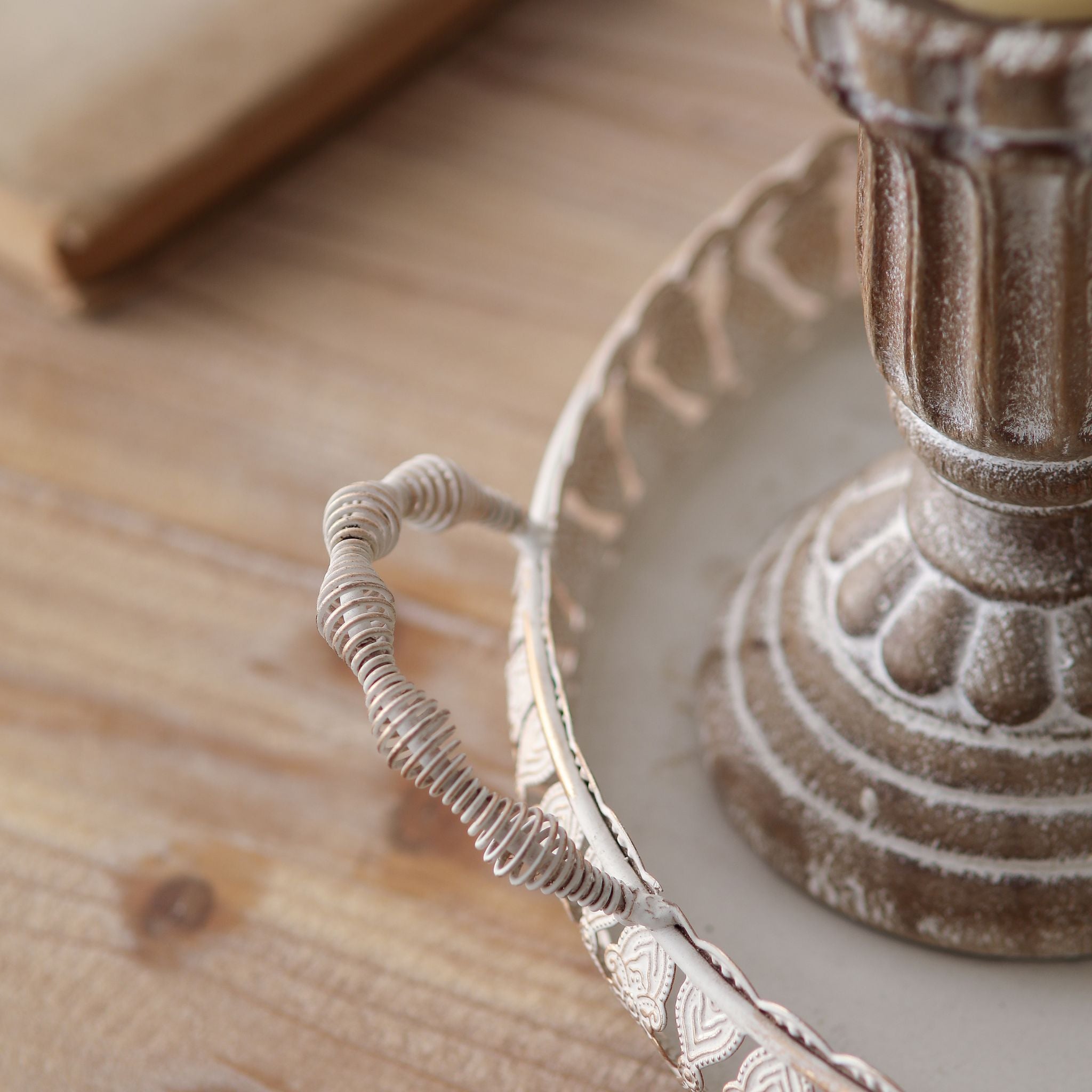 Close view of the twisted coiled-wire handle on the Jewel tray